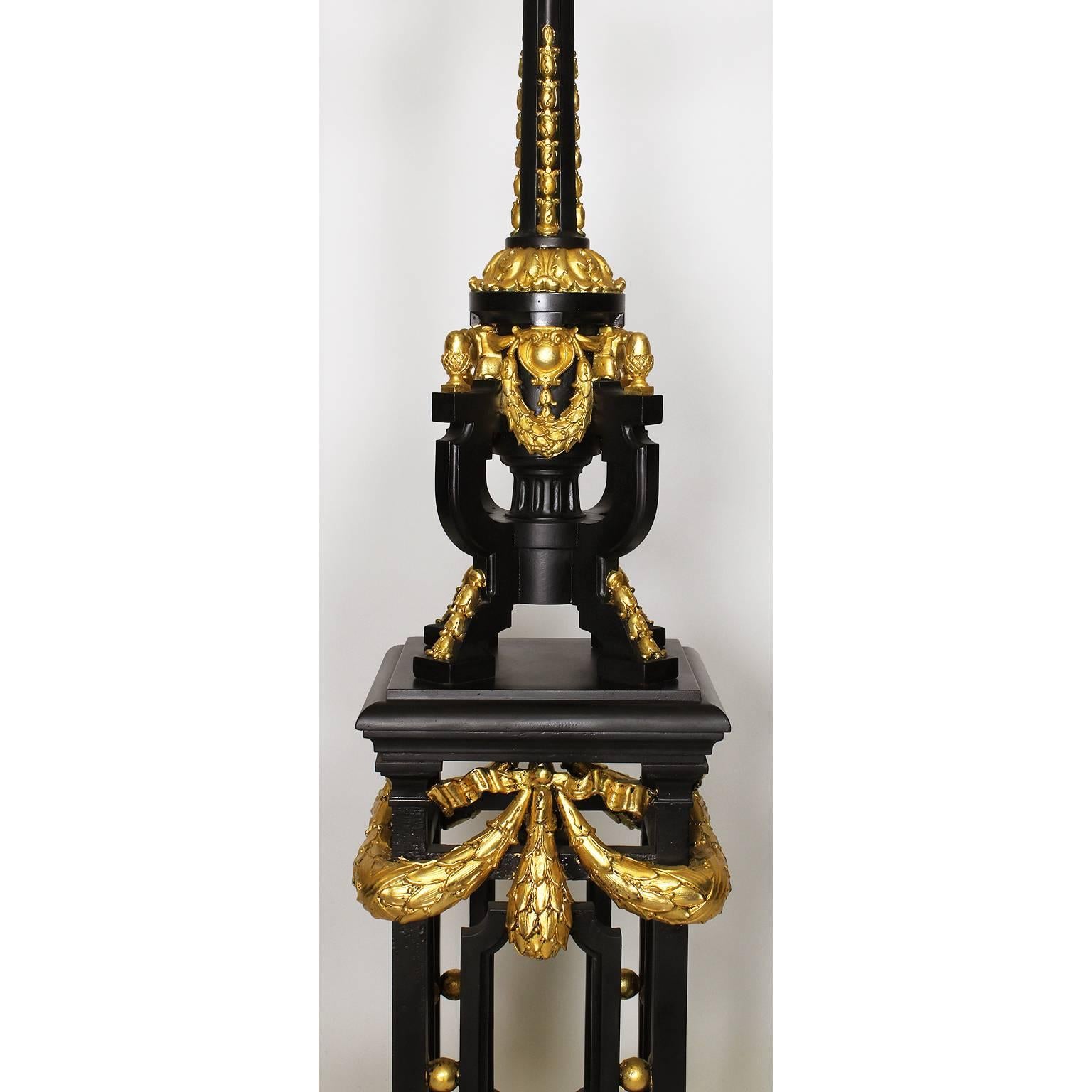 Cast Pair French 19th-20th Century Neoclassical Style Iron and Parcel-Gilt Torcheres For Sale