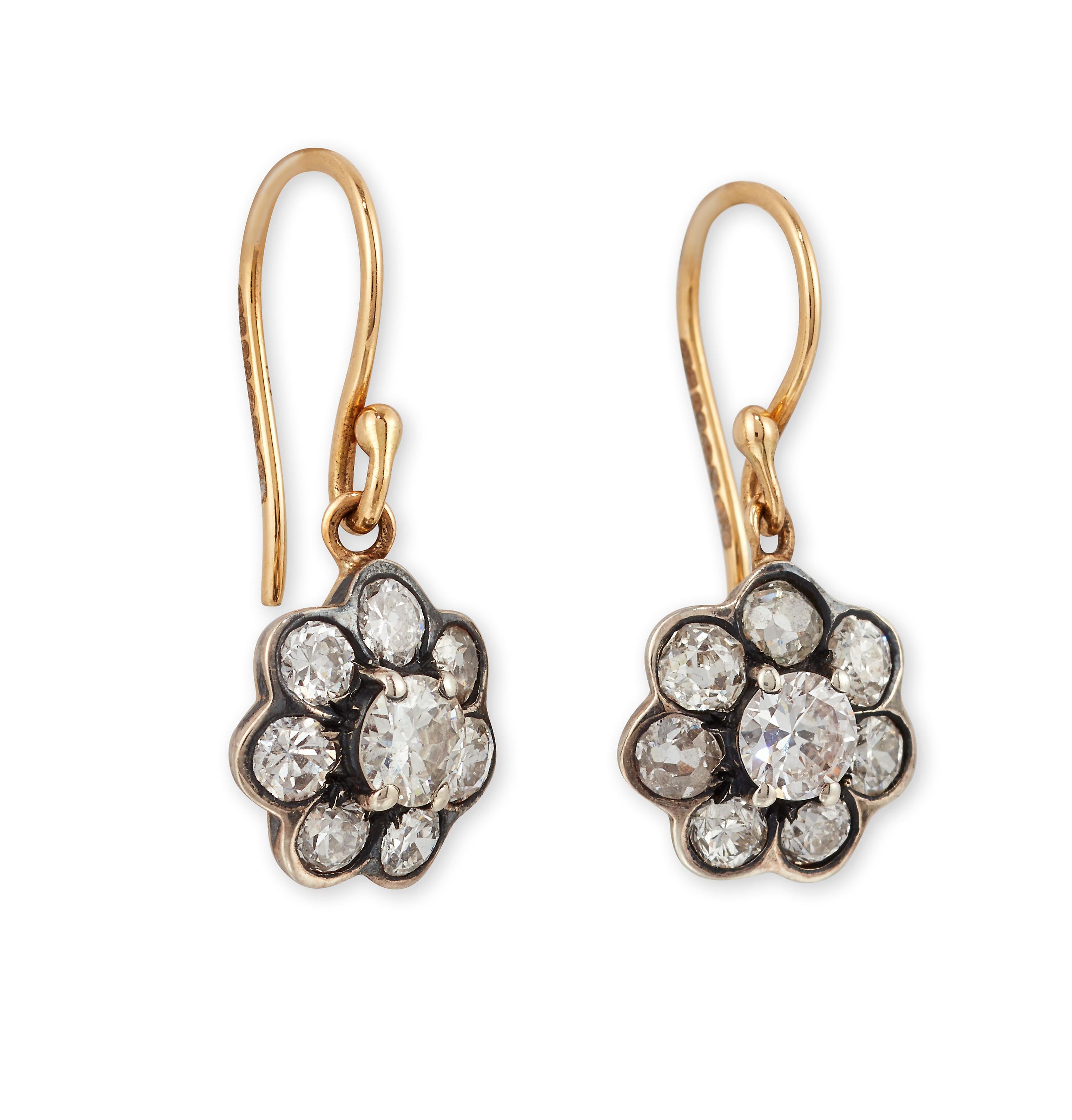 Beautiful pair of Old-Cut Diamond cluster earrings.

Set with old brilliant-cut Diamonds, within a silver and 18ct Yellow gold setting, with hook fittings, these stunning earrings move and catch the light perfectly.
 
  