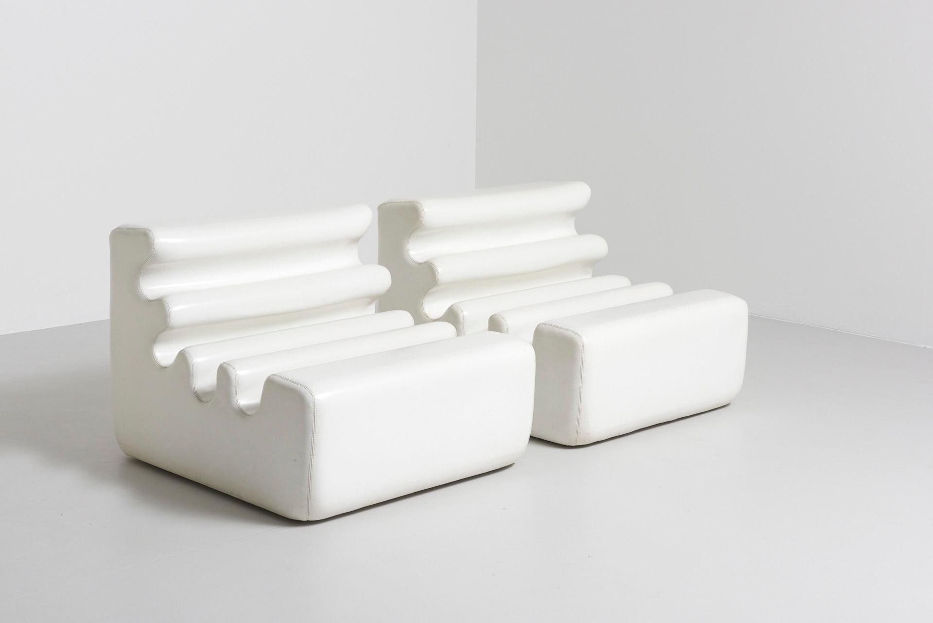 A set of 2 'Karelia' easy chairs in white. Designed in 1966 by the Finnish designer Liisi Beckmann for Zanotta. Polyurethan foam with vinyl cover. Made in Italy.