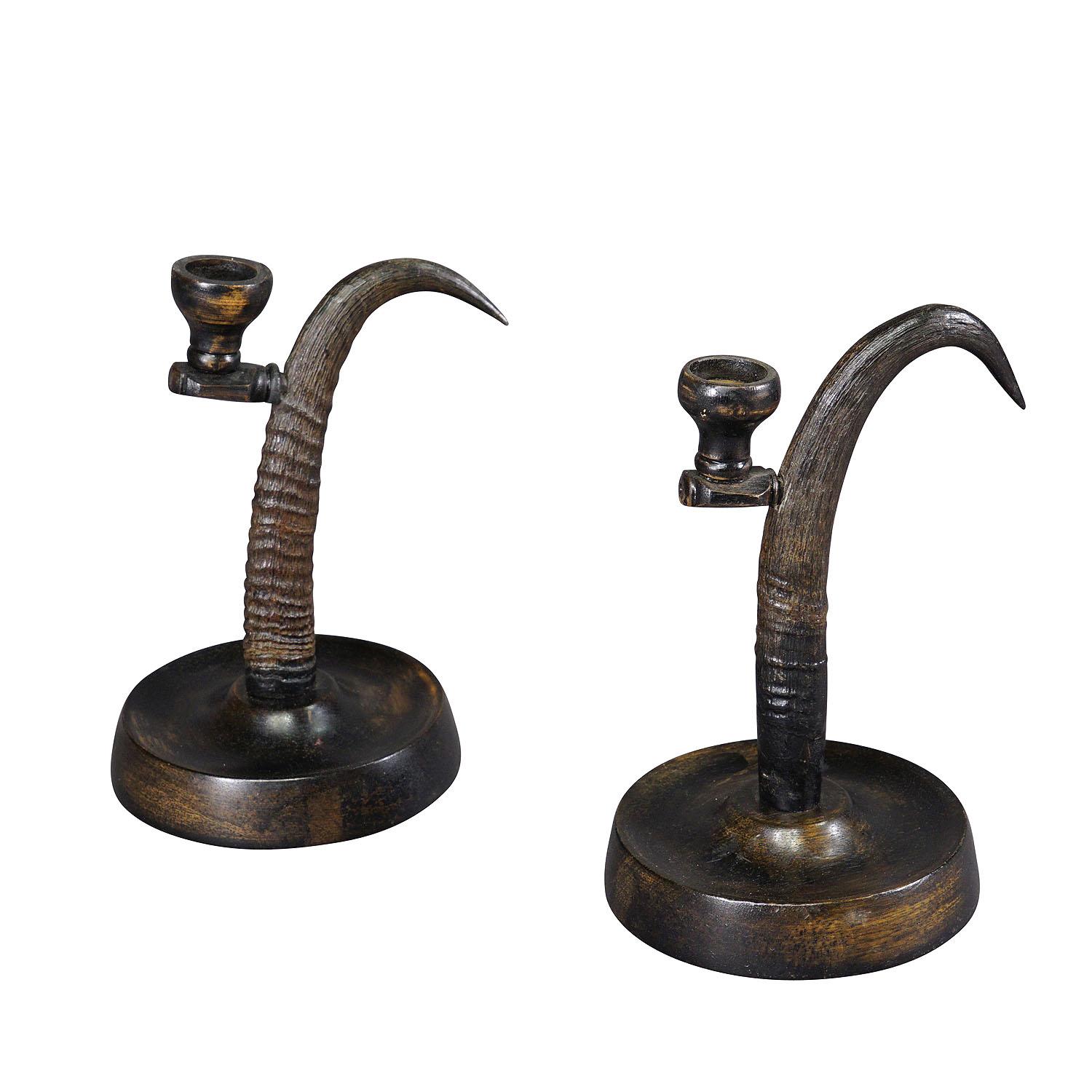 A Pair Lovely Antique Candle Holders with Chamois Horns

A lovely pair of rustic candle holders, made of horns from the chamois. The spout and base are made of turned and ebonized wood. Executed in Germany ca. 1900. They are a wonderful addition to
