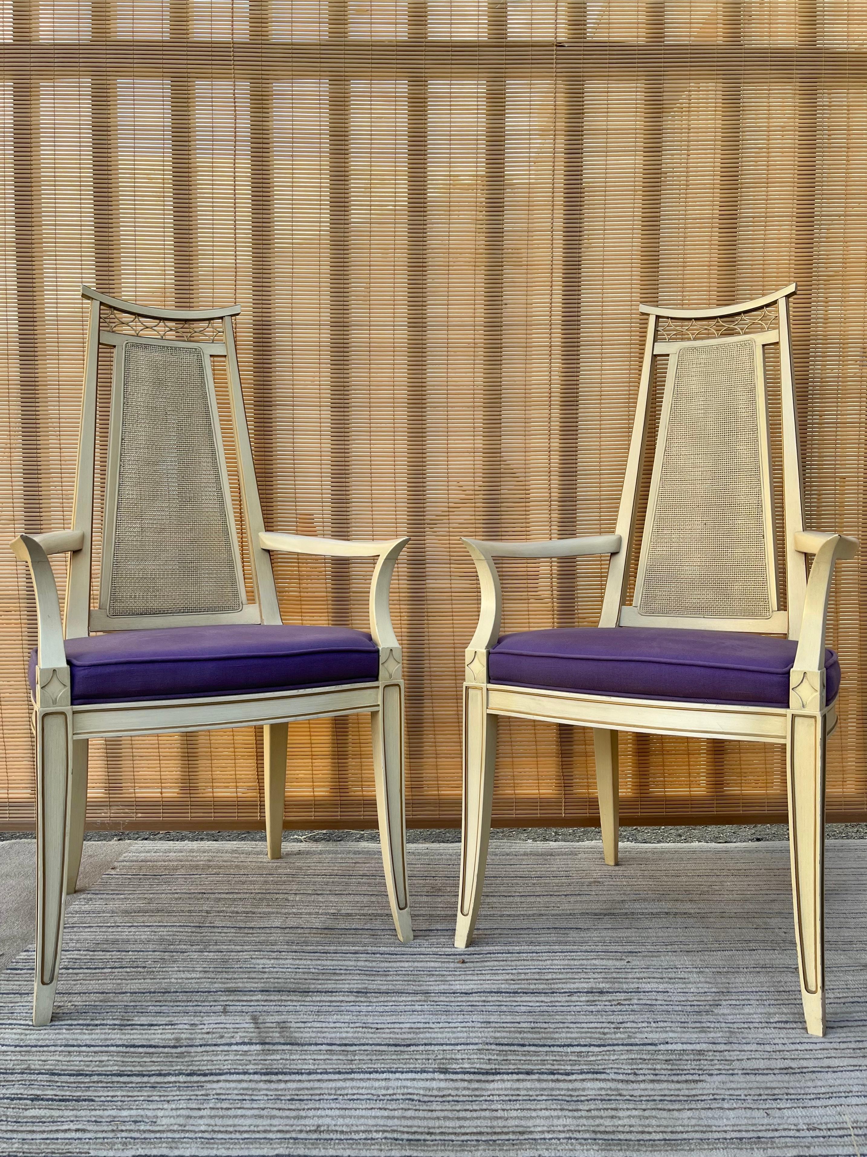 A Set of two Vintage Mid-Century / Hollywood Regency Walnut Arm Side / Dining Chairs by Dixon Powdermaker Jacksonville Florida. Circa 1960s
Feature a sleek Mid Century design with caning backs, a pagoda Chinoiserie inspired detail, the original
