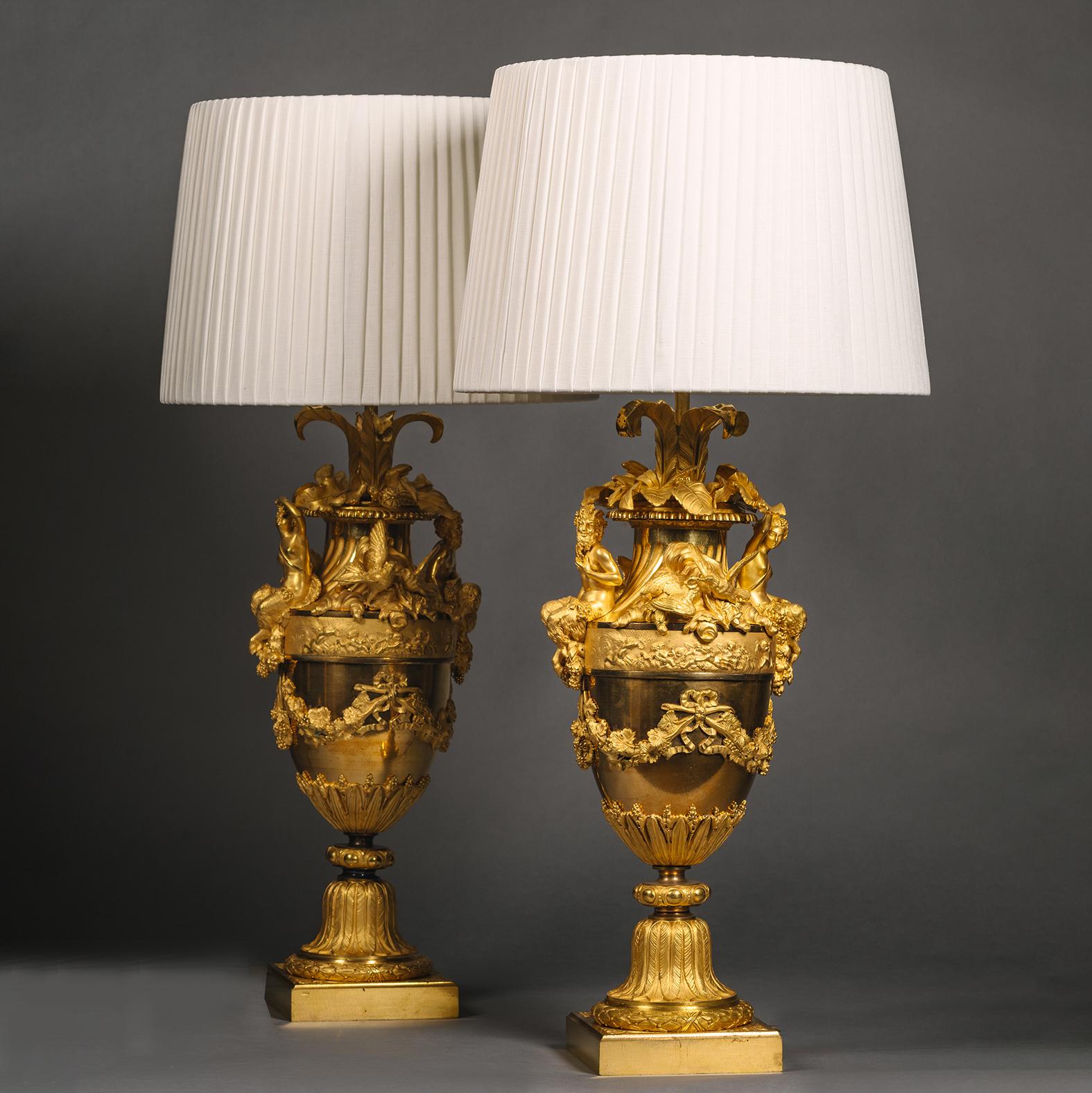 A Pair of Fine Napoleon III Period Gilt-Bronze Vases, Mounted as Table Lamps, By Henri Picard. 

These vases exhibit finely detailed bronze work with superb matte and burnished gilding. They are conceived in the Louis XVI stye and adorned with