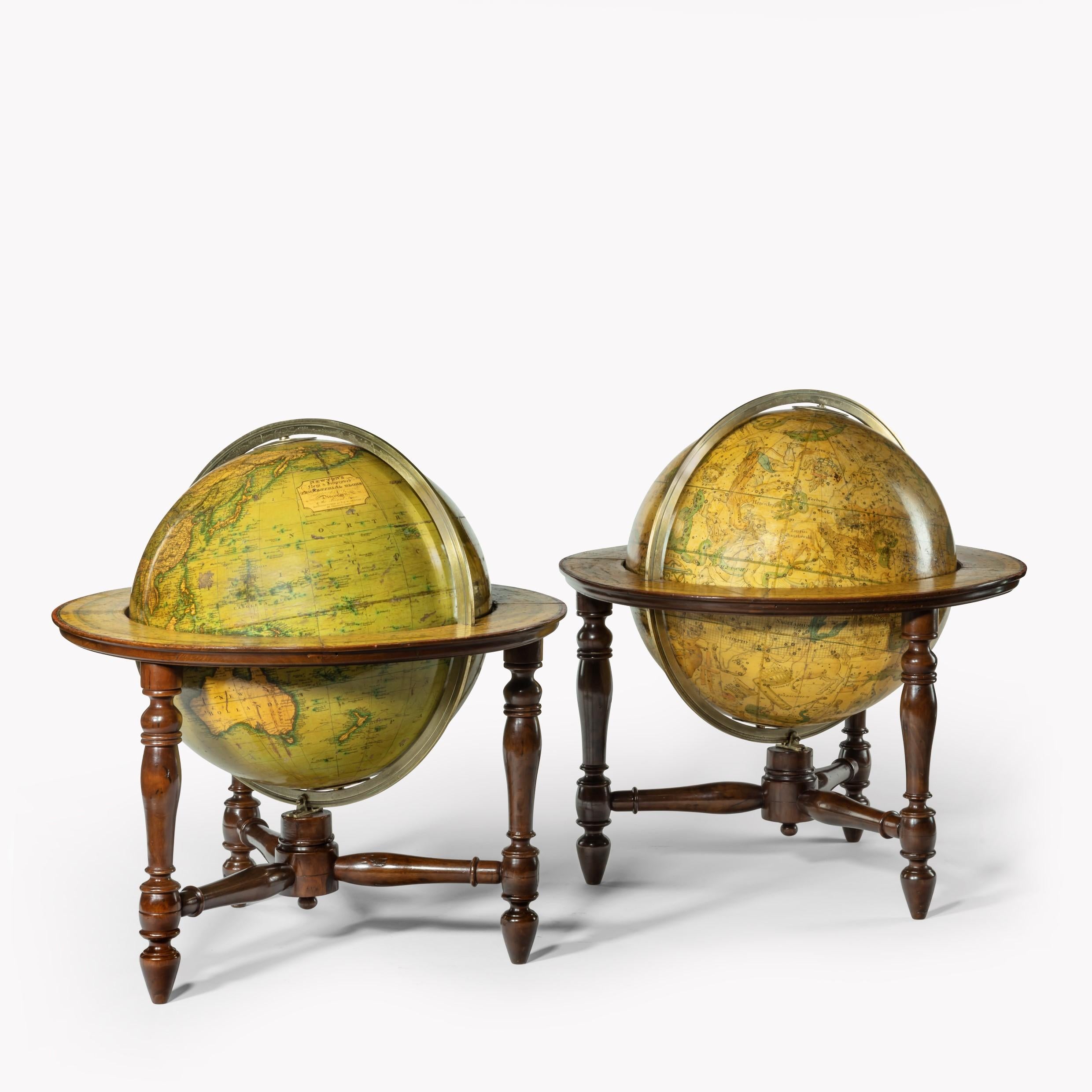 A pair of 12 inch table globes by J & W Newton, dated 1820, each with 12 hand coloured gores, graduated meridian rings, set within ebonised stands with three turned legs. The terrestrial globe stating ‘Newton’s New & Improved Terrestrial Globe