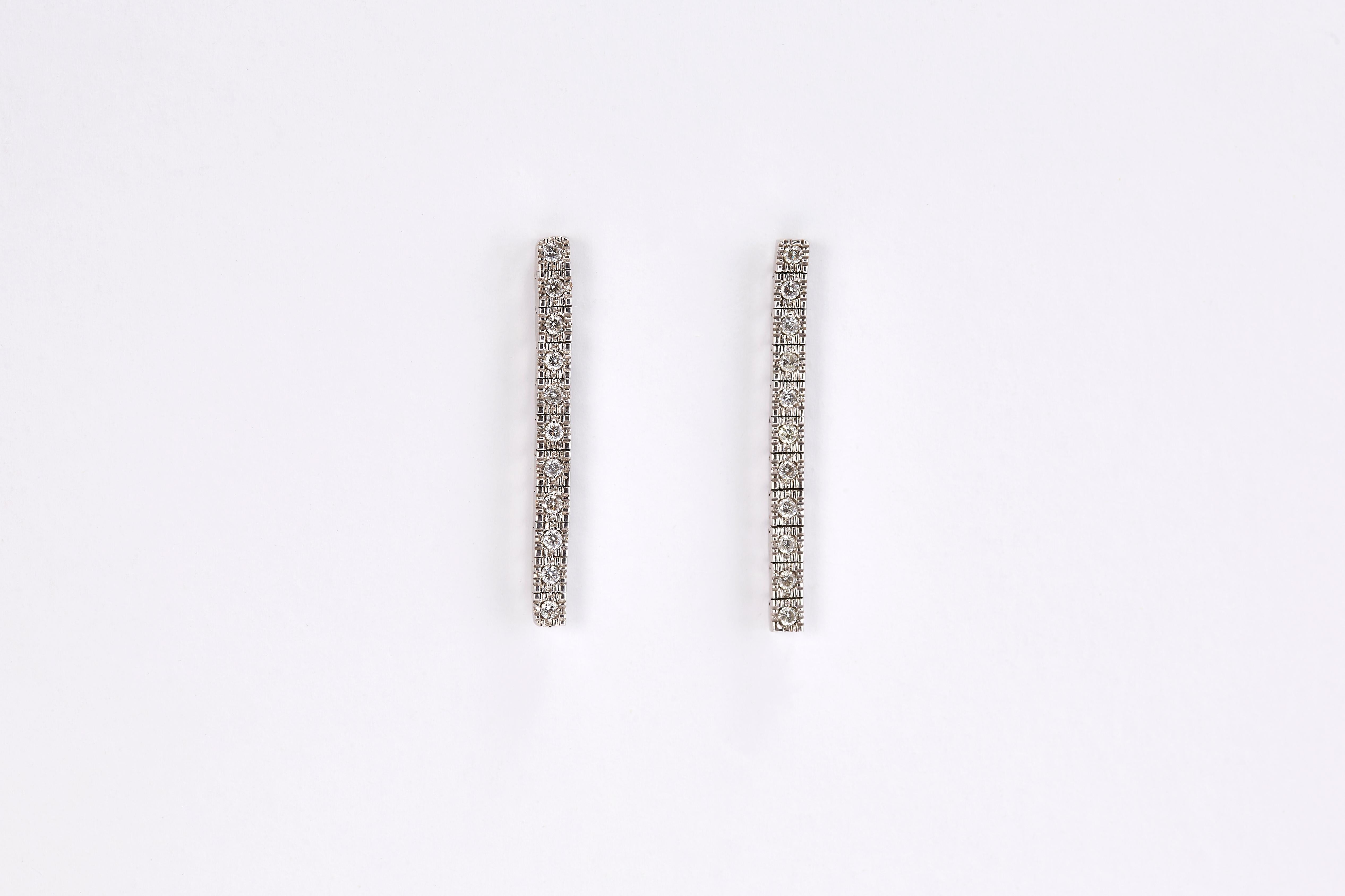 Pair of 14 Karat White Gold Row Diamond Drop Earrings In Excellent Condition For Sale In Tel Aviv, IL