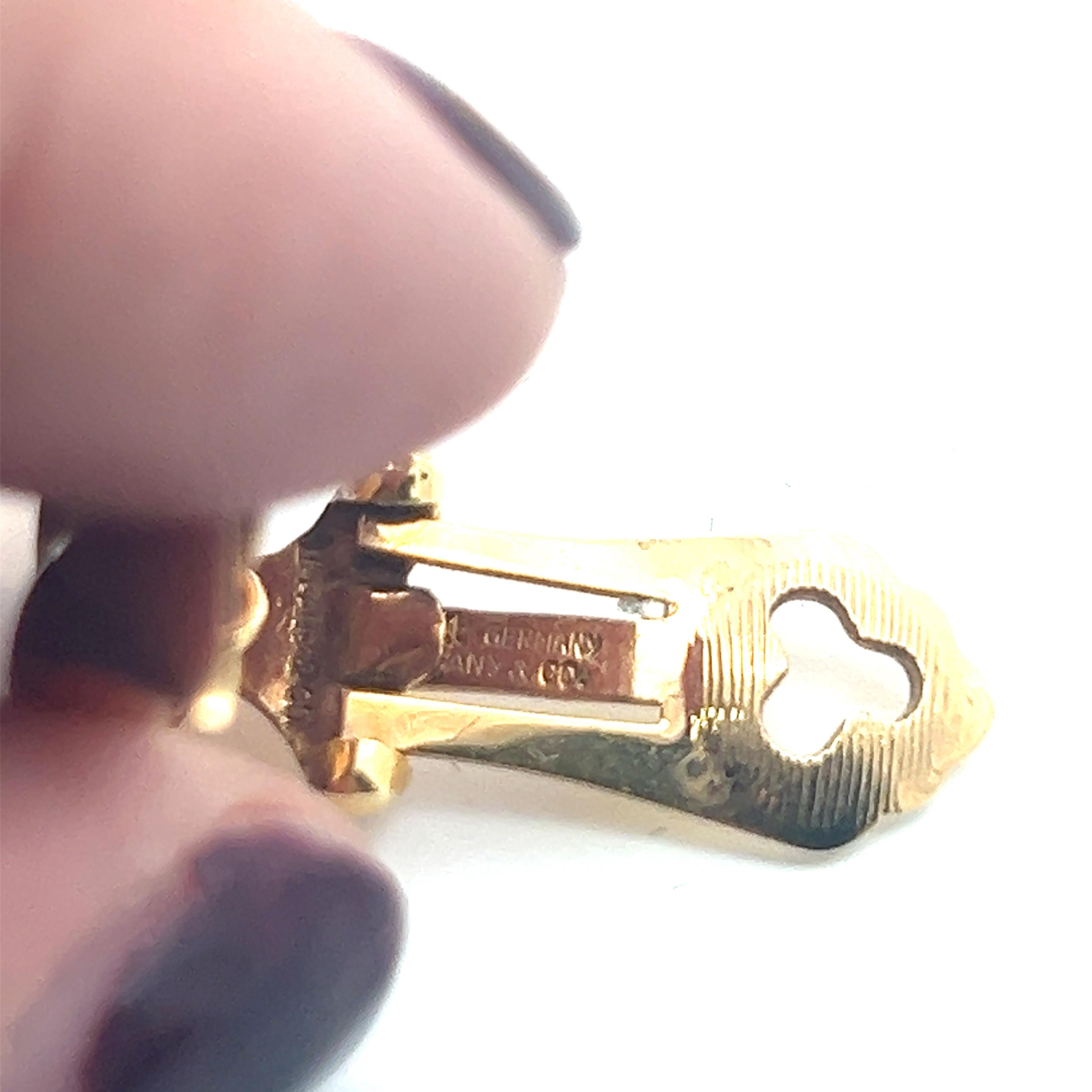 A pair of 14k yellow gold ear clips by Tiffany & Co. 7