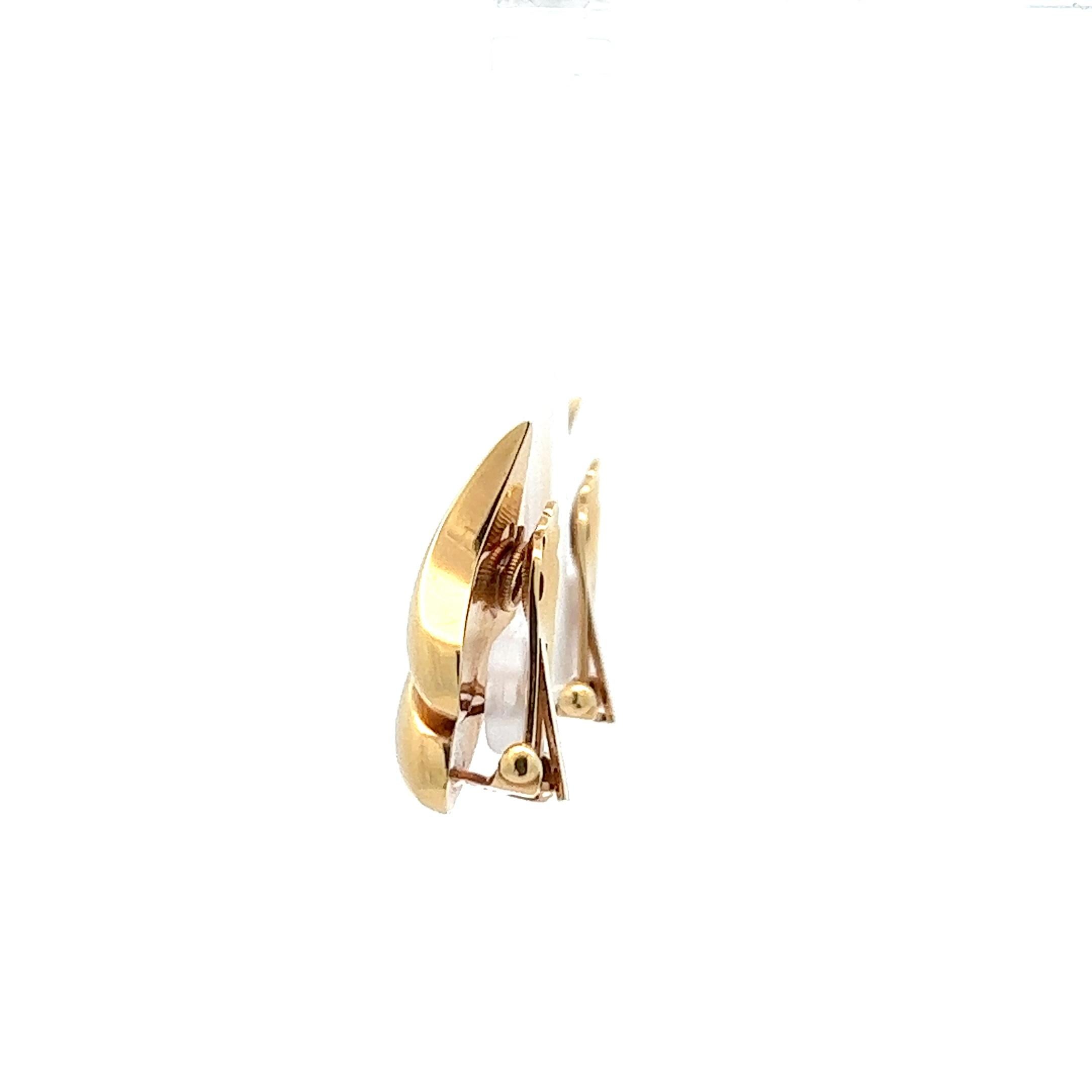 A pair of 14k yellow gold ear clips by Tiffany & Co. 1