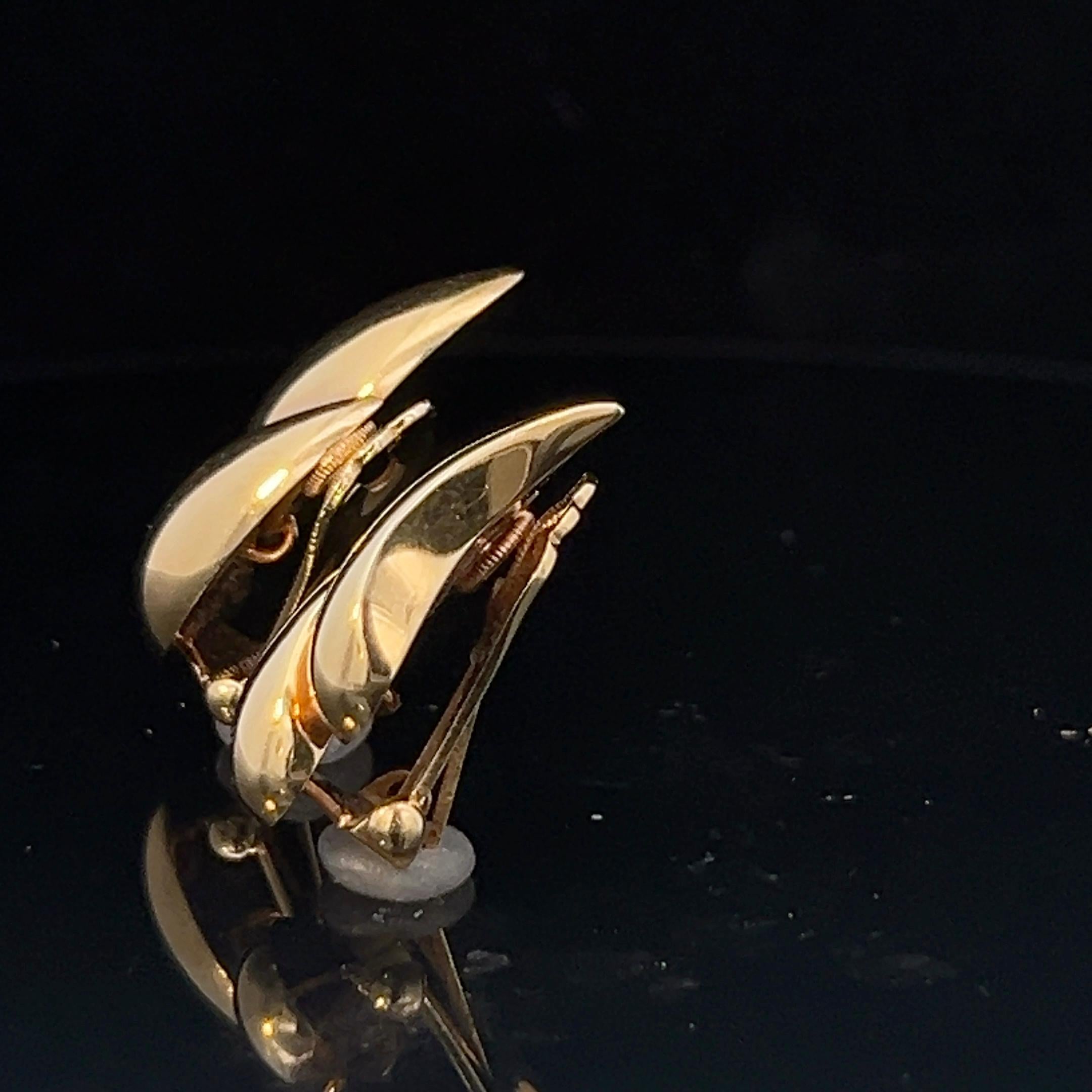 A pair of 14k yellow gold ear clips by Tiffany & Co. 5