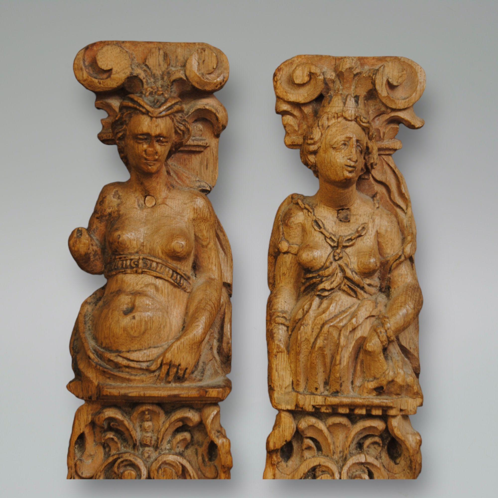A pair of 17th century oak caryatids with female terms and finely carved decoration.