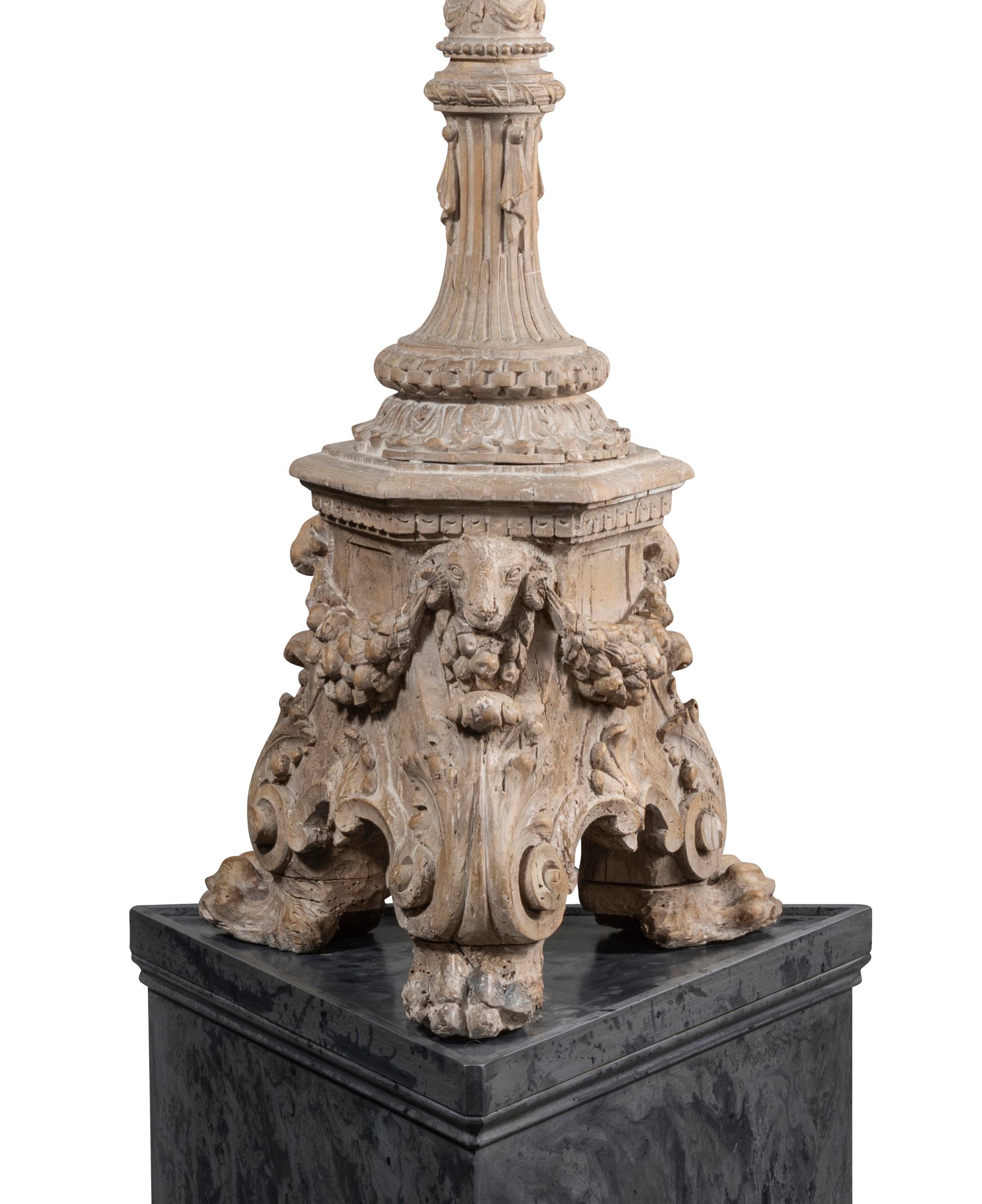 Each with foliated metal drip trays atop the multi baluster stem, the gadrooned capital on fluted column, the central frieze of putti holding fillets and floral garlands, the lower column with swags, drapery pendants; the molding with bead and reel,