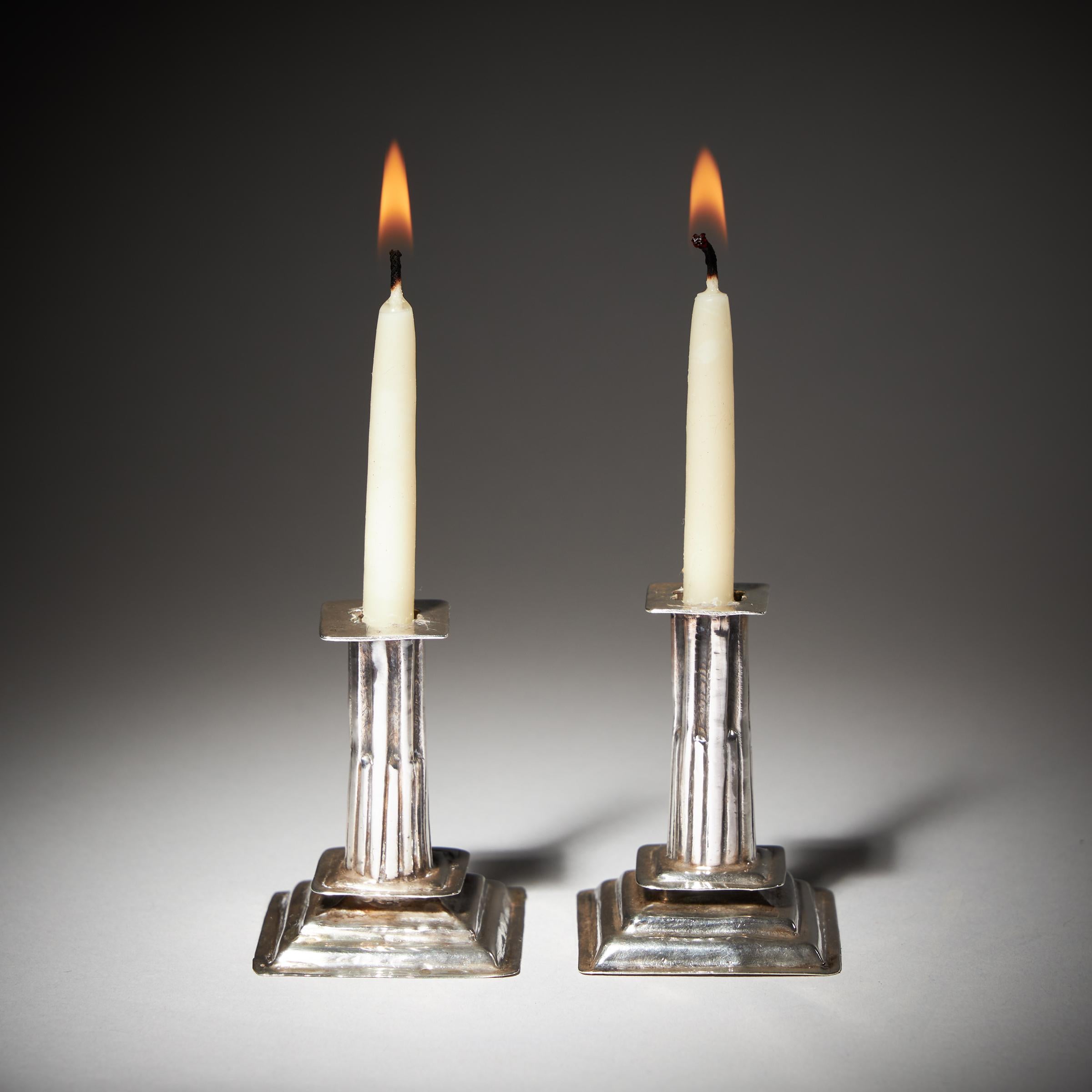A pair of very fine and exceptionally rare 17th Century William and Mary period miniature candlesticks by the renowned London Silversmith, George Manjoy (working c.1675-1720). 

They are dated O (1690/1691) and have the hallmark for George Manjoy.  