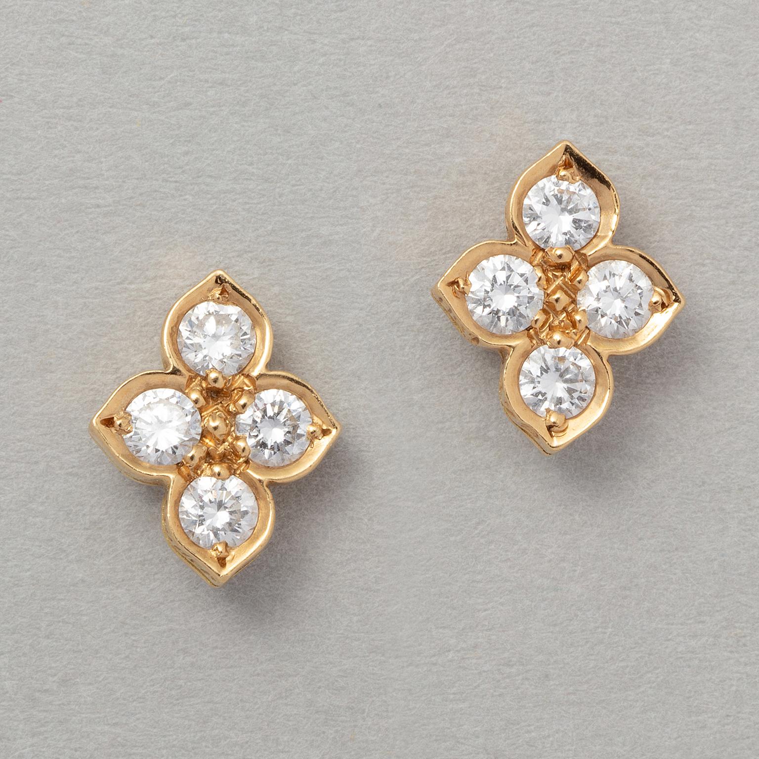A pair of 18 carat yellow gold stud earrings in the shape of a flower, each set with 4 brilliant cut diamonds (circa 0.56 ct in total). Signed and numbered: Cartier, H61 479.

weight: 2.4 grams
dimensions: 1 x 0.8 cm.