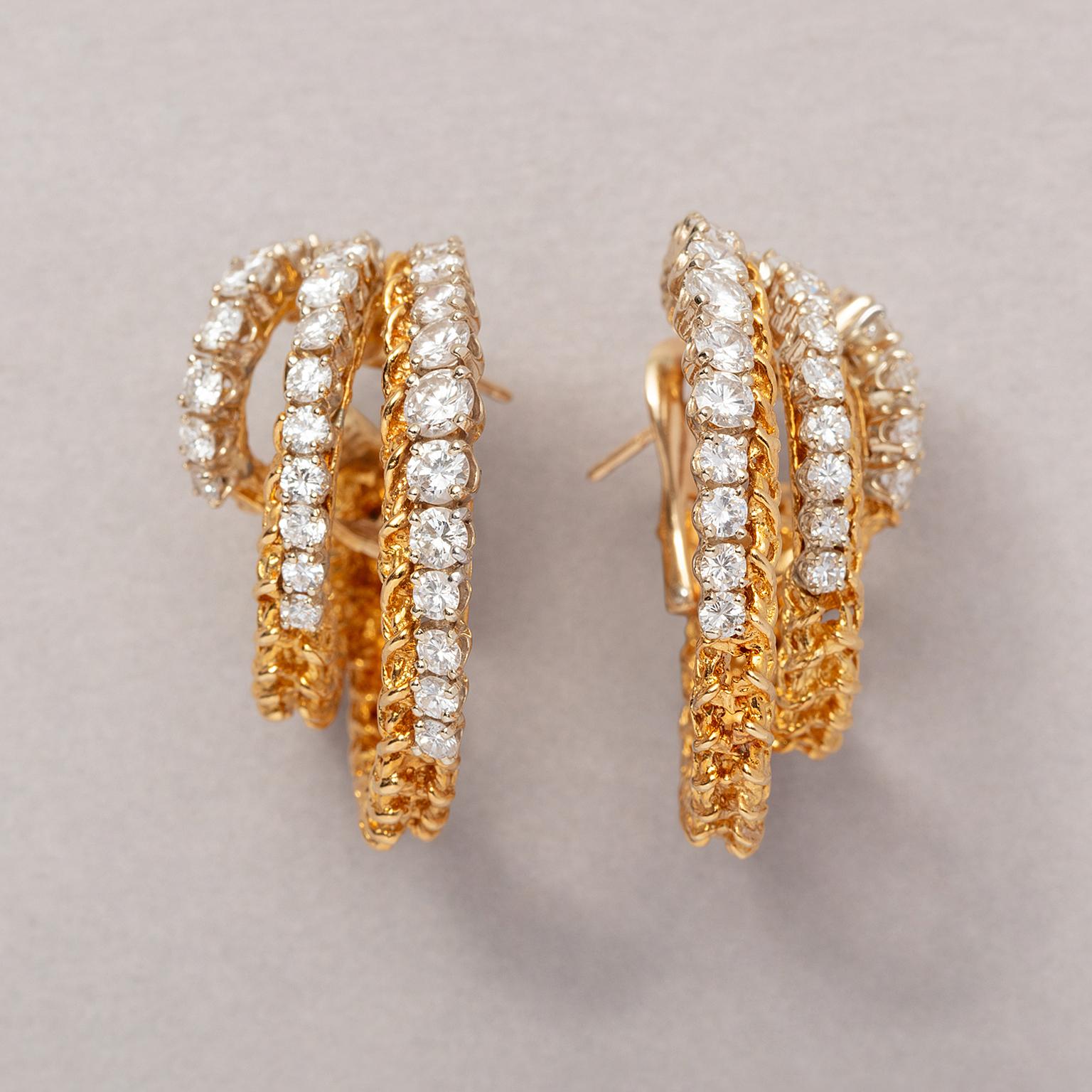 A Pair of 18 Carat Gold Triple Hoop Earrings 1