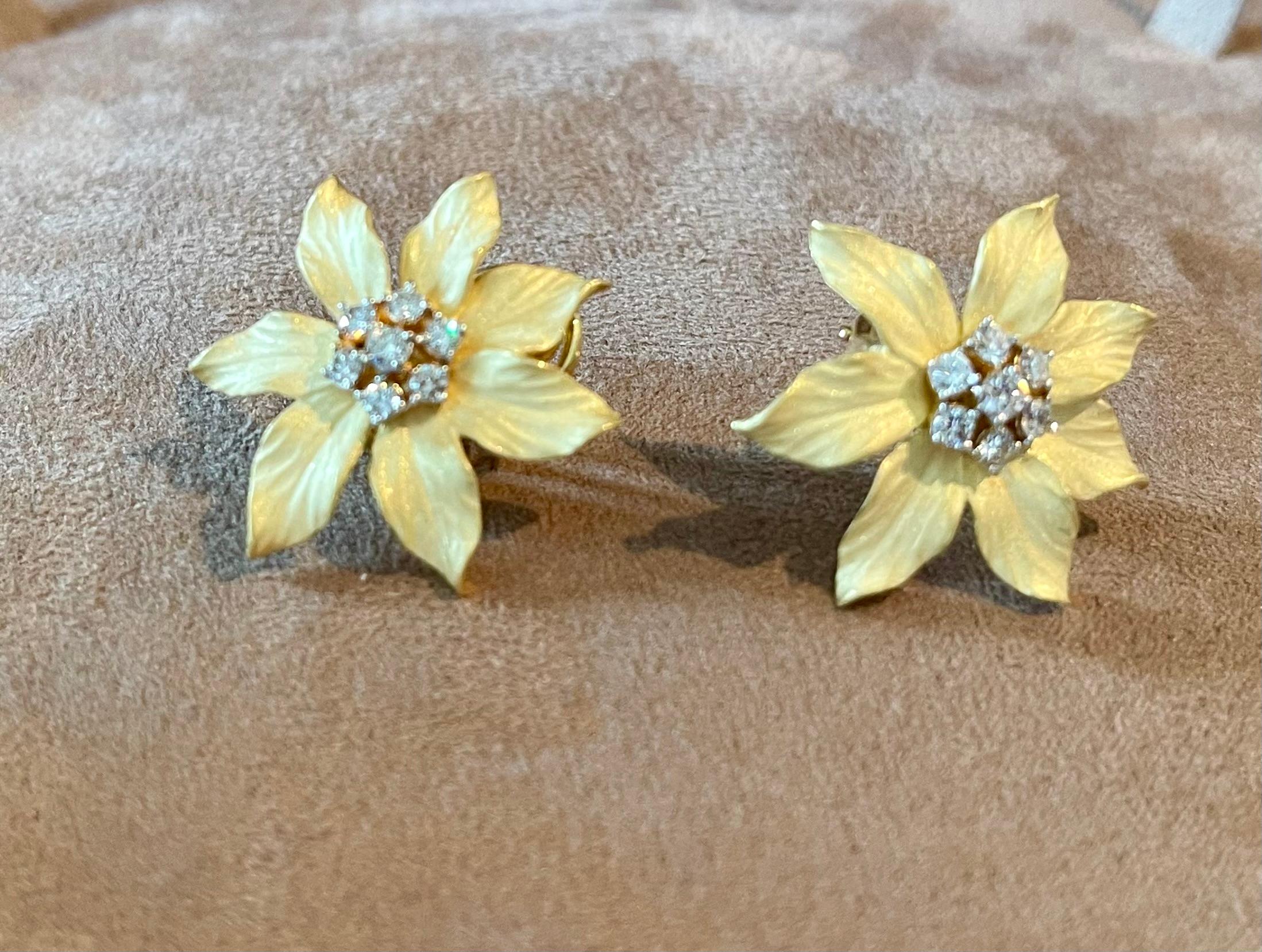 Fabulous 18 K yellow Gold Flower earrings with a lovely brushed gold texture that creates a unique and sophisticated look.  Crafted to have 7 flower petals that feature 7 gleaming round brilliant cut diamonds, G color, VS1 clarity. The 14 round
