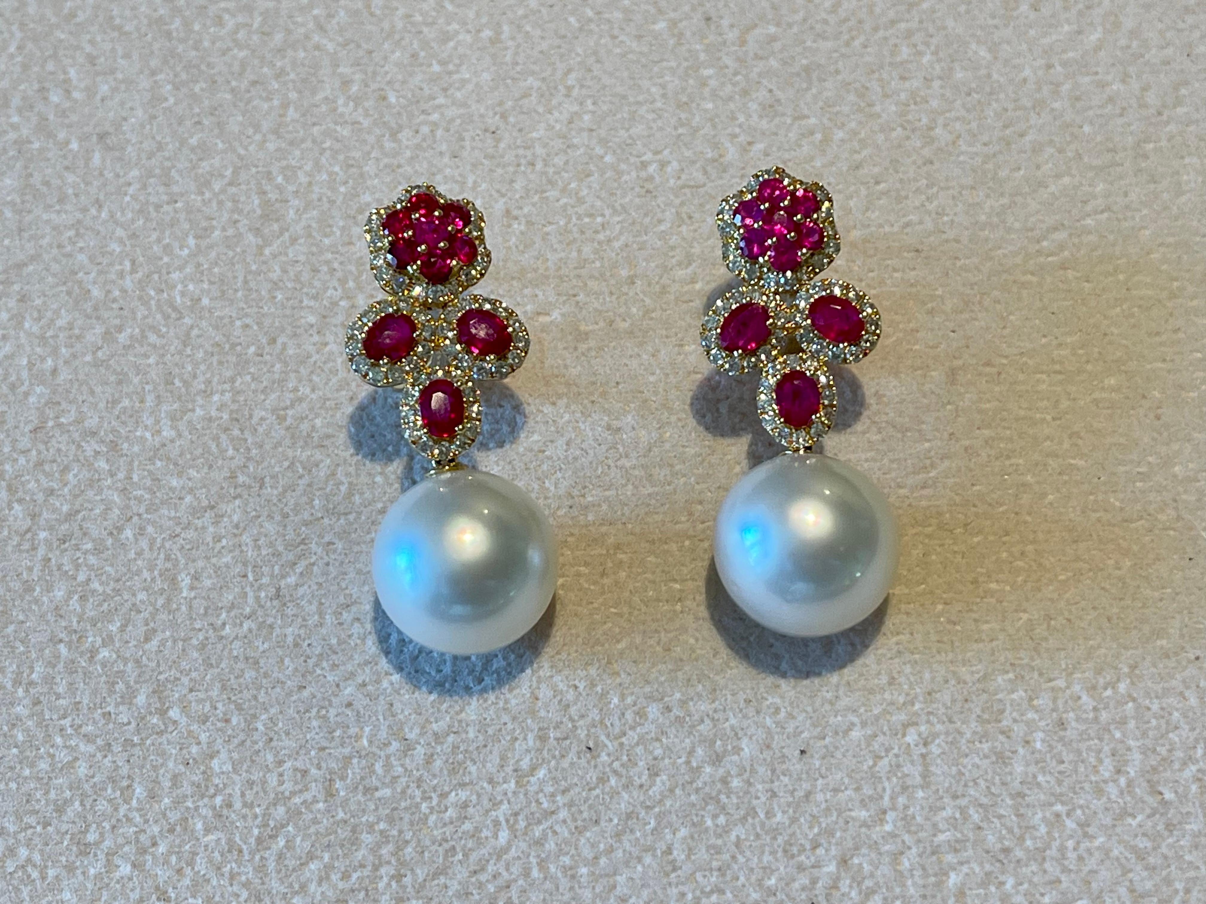 Brilliant Cut A pair of 18 K yellow Gold Diamond Ruby South Sea Pearl earrings For Sale