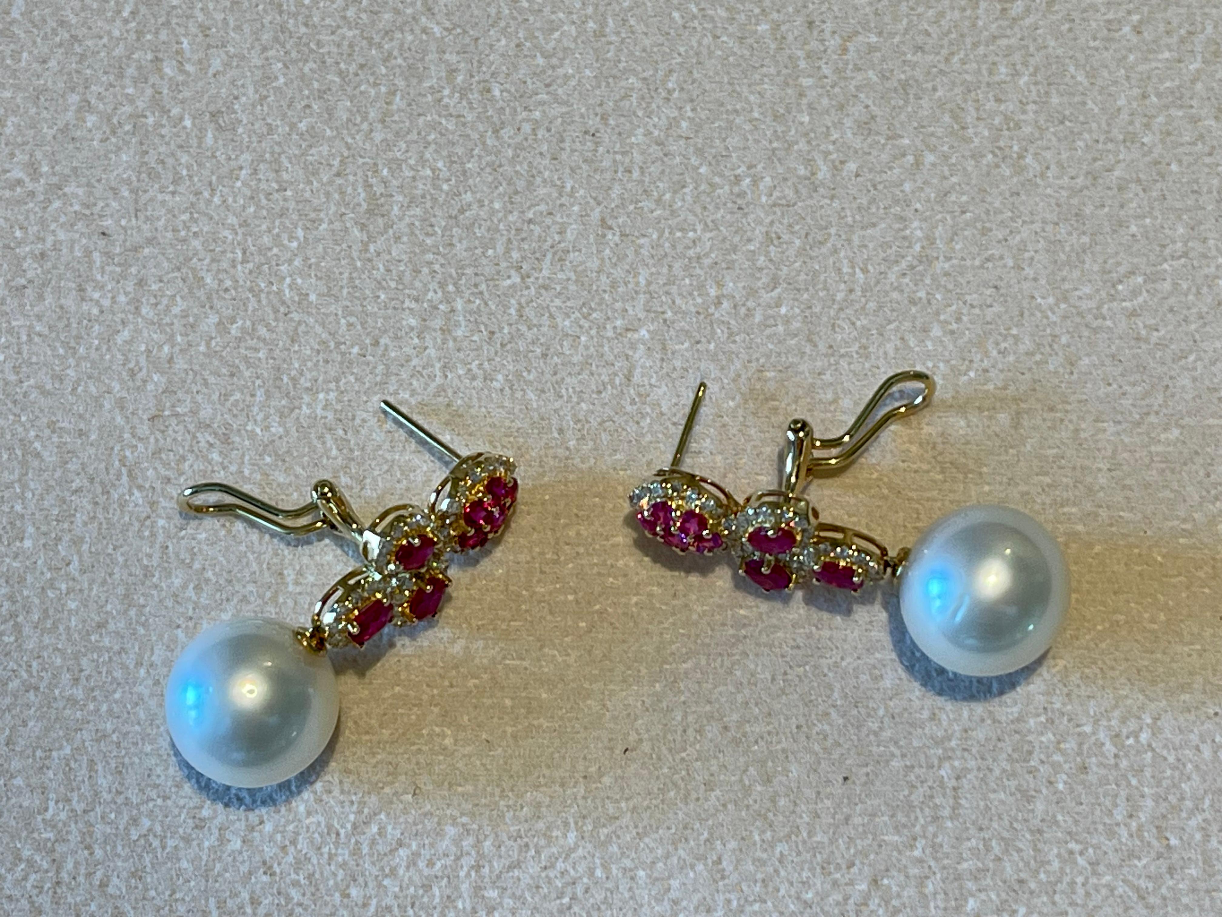 A pair of 18 K yellow Gold Diamond Ruby South Sea Pearl earrings For Sale 2