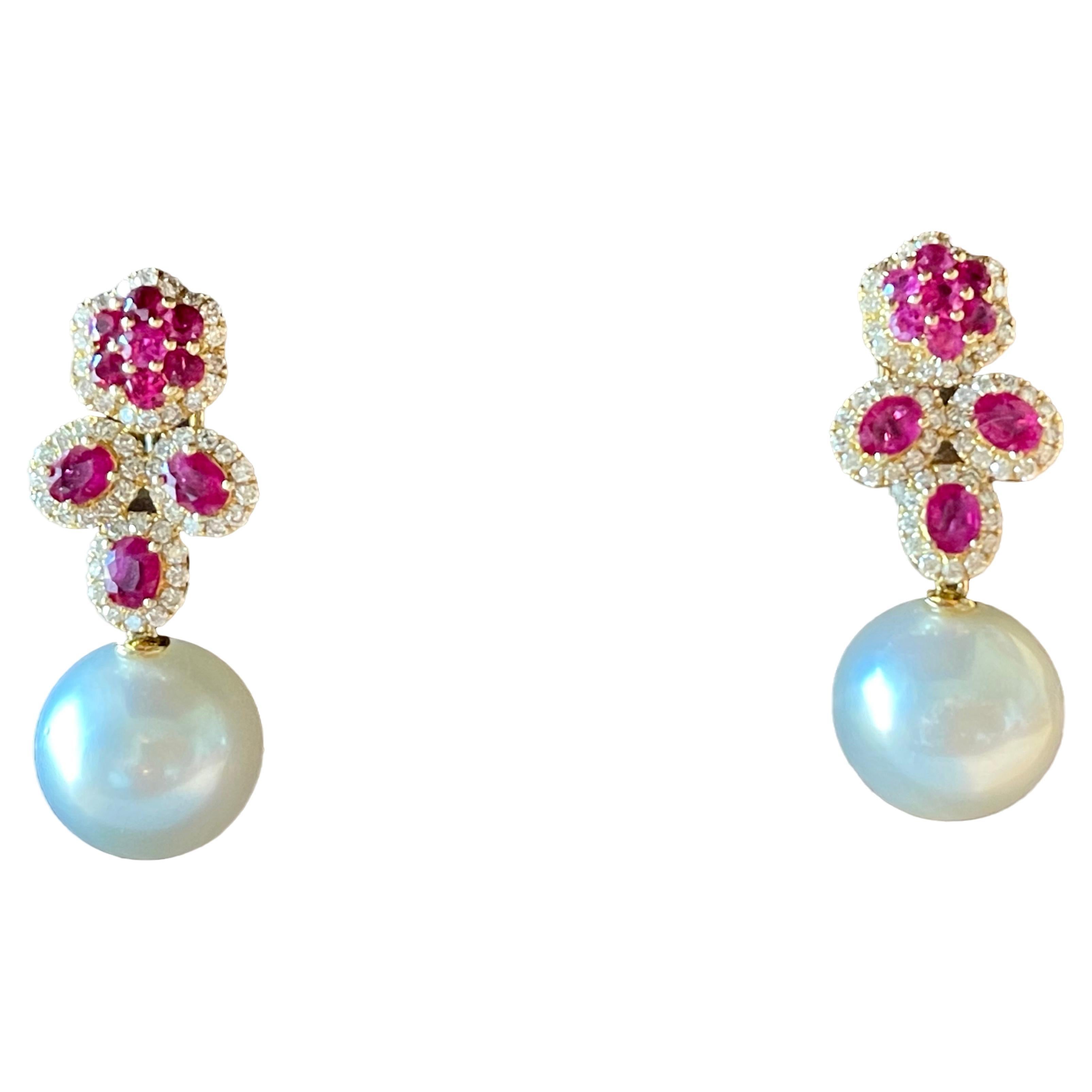A pair of 18 K yellow Gold Diamond Ruby South Sea Pearl earrings For Sale