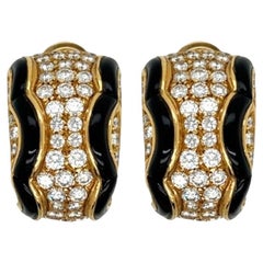 A Pair of 18 Karat Yellow Gold, Black Onyx and Diamond Earrings