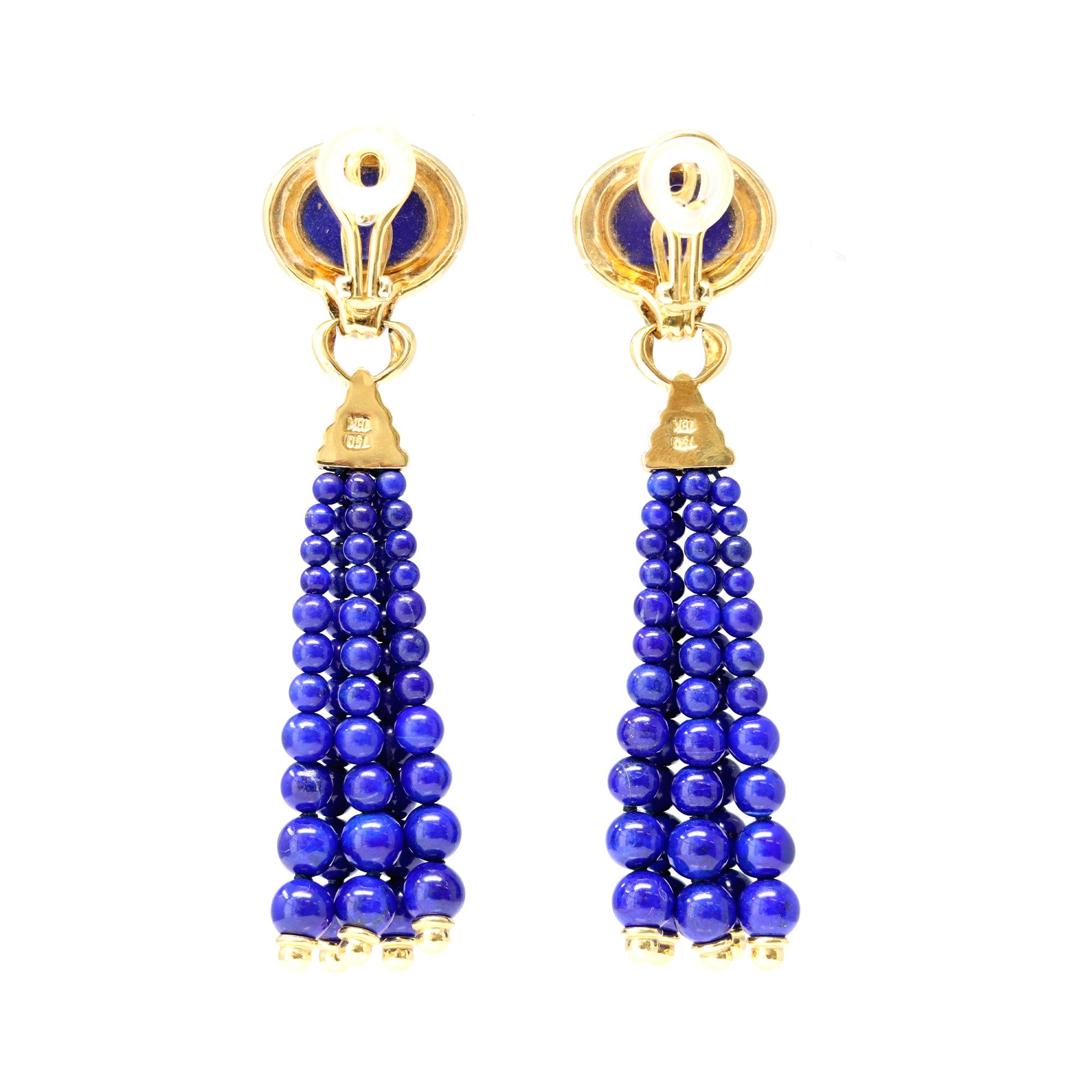 A striking pair of natural vivid blue lapis lazuli tassel earrings, with diamond accent. The earrings are set in 18 karat yellow gold and have a gross weight of 32.9 grams. The estimated weight of the diamonds is 0.25 carats, GH color and Vs-SI
