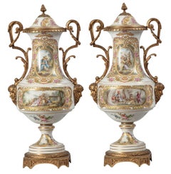 A Pair of 1800s Ormolu-Mounted French Sevres Style Drum-Shaped Vases and Covers