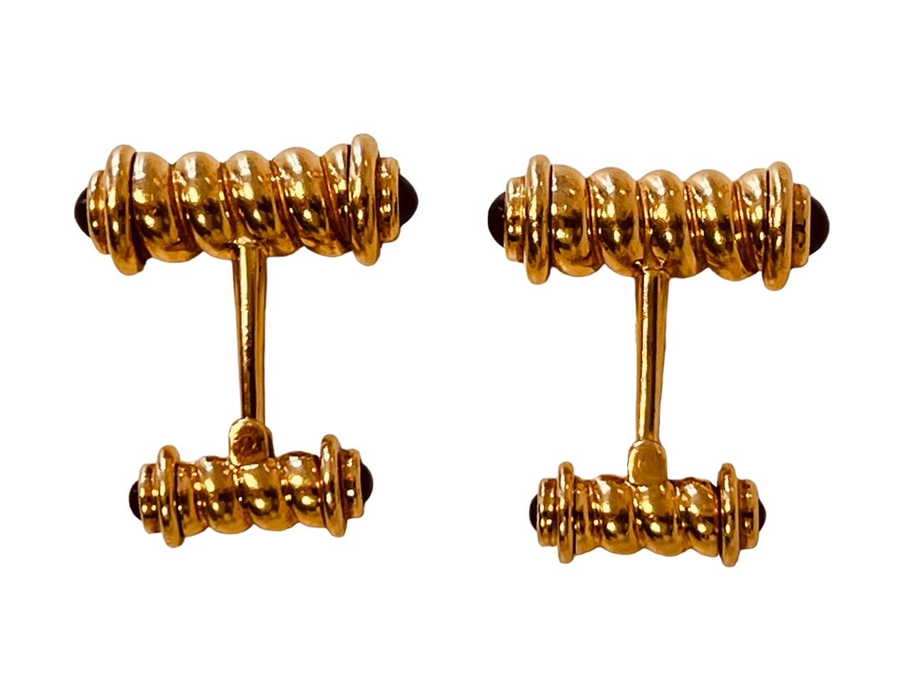 ASPREY. A 18ct pair of cufflinks. The rope twist bars mounted with cabochon sapphire terminals. Makers signature and hallmarks for 18ct. Weight: 24.8g. Price: 5,150£. Item is in very good condition without any damage. Return policy within 3 days is