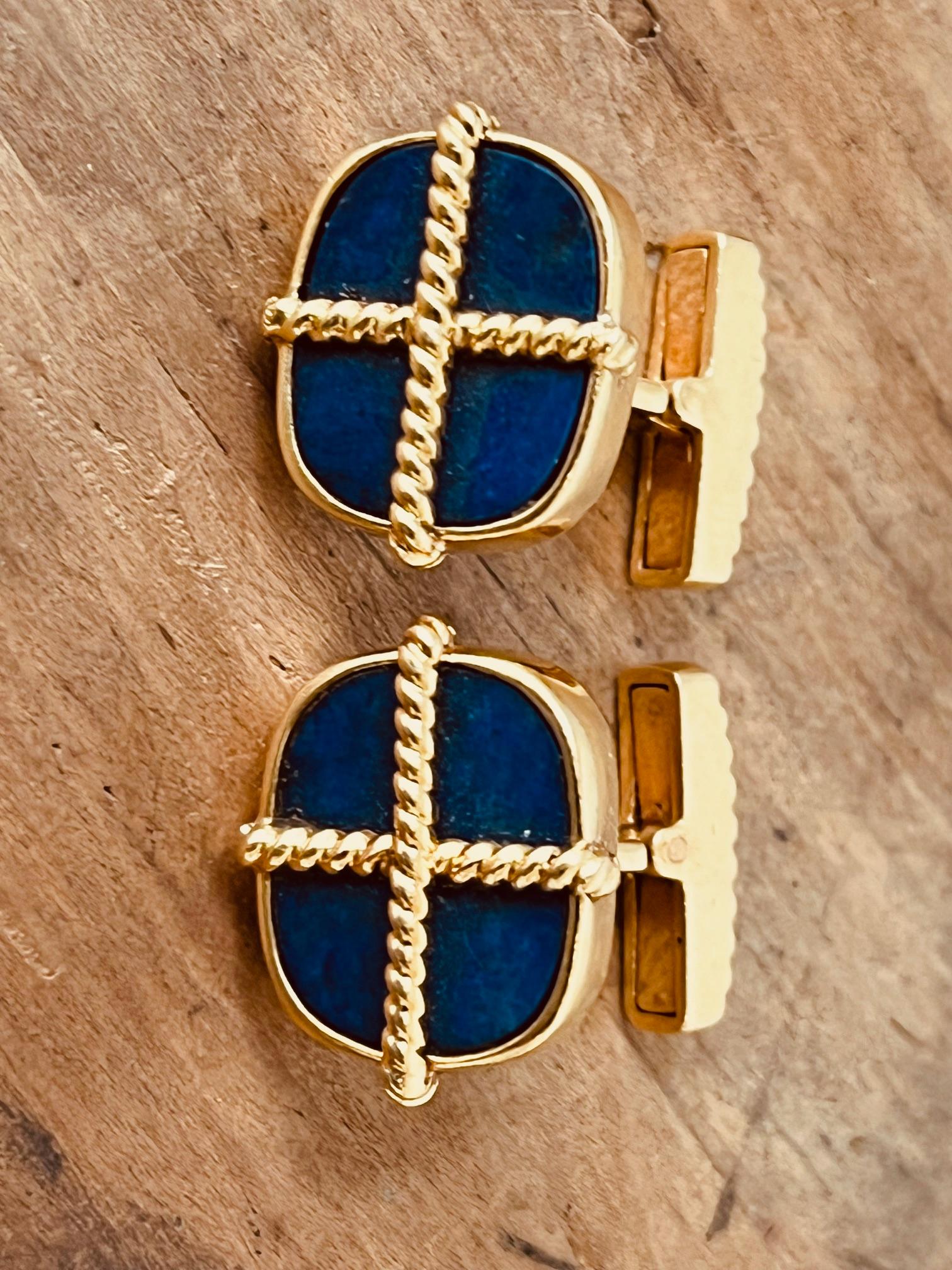 A pair of 18ct yellow gold and Lapis Lazuli cufflinks. Circa 1970's. Weight: 17.4g. Price: 4,150£. Item is in very good condition without any damage. Return policy within 3 days is applied. Please make sure you watch the short video that gives real