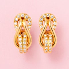 a Pair of 18K Gold and Diamond Cartier Knot Earrings