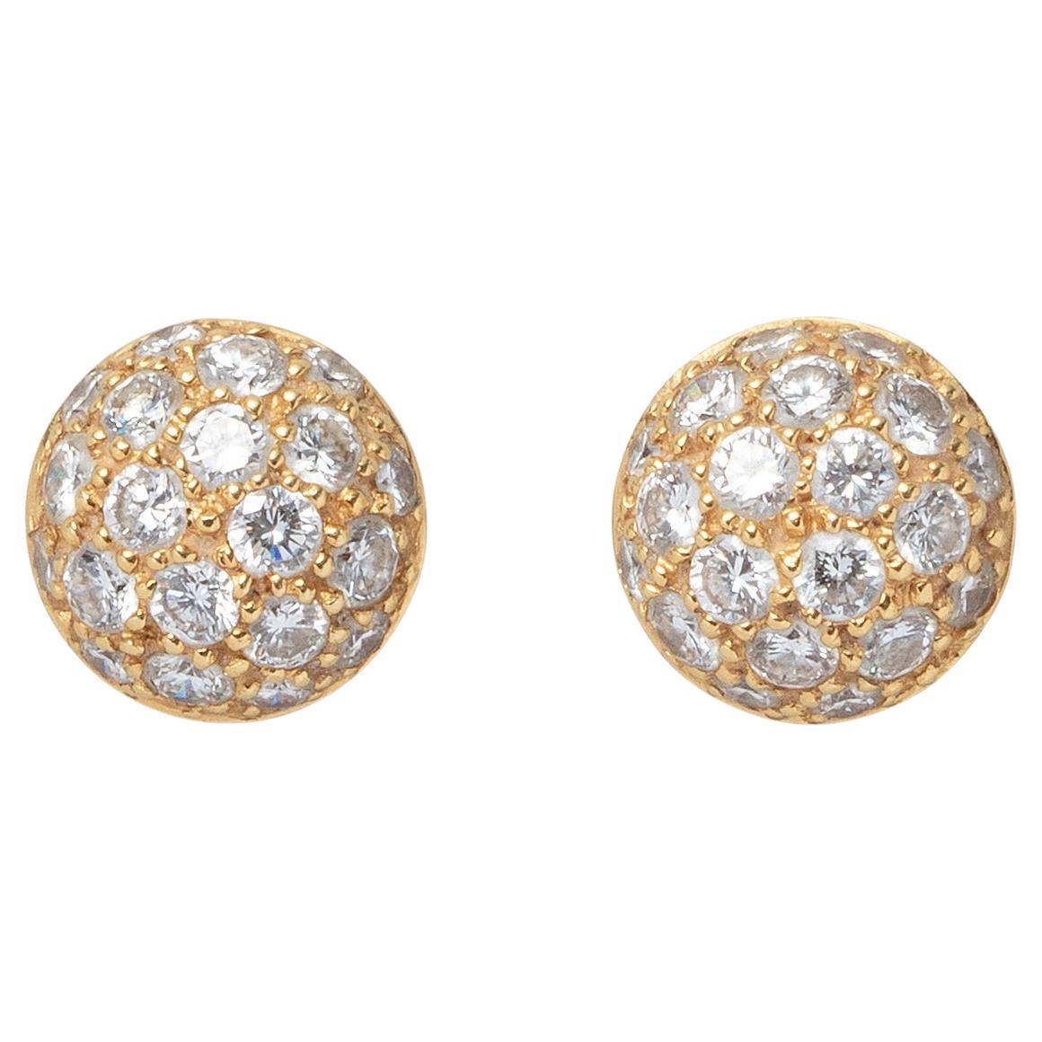A Pair of 18k Gold Cartier Studs with Diamond