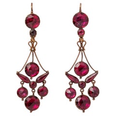 A pair of 18k Gold Girandole Earrings with Garnets