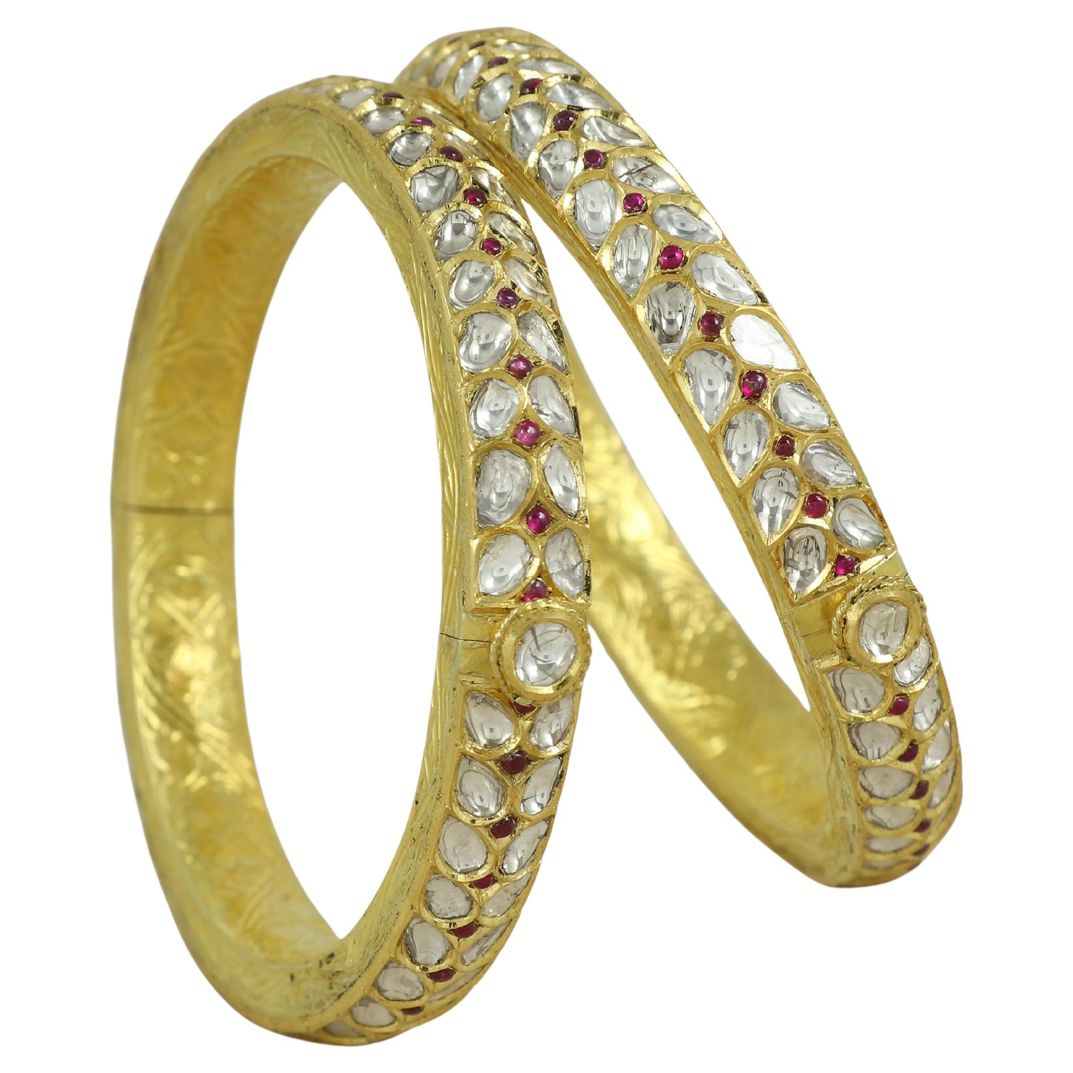 A pair of 18K gold kundan Meena polki bangle set with diamond polkis and rubies