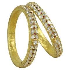 A pair of 18K gold kundan Meena polki bangle set with diamond polkis and rubies