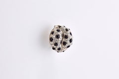 Coppia di orecchini in oro bianco 18 carati con diamanti e onice