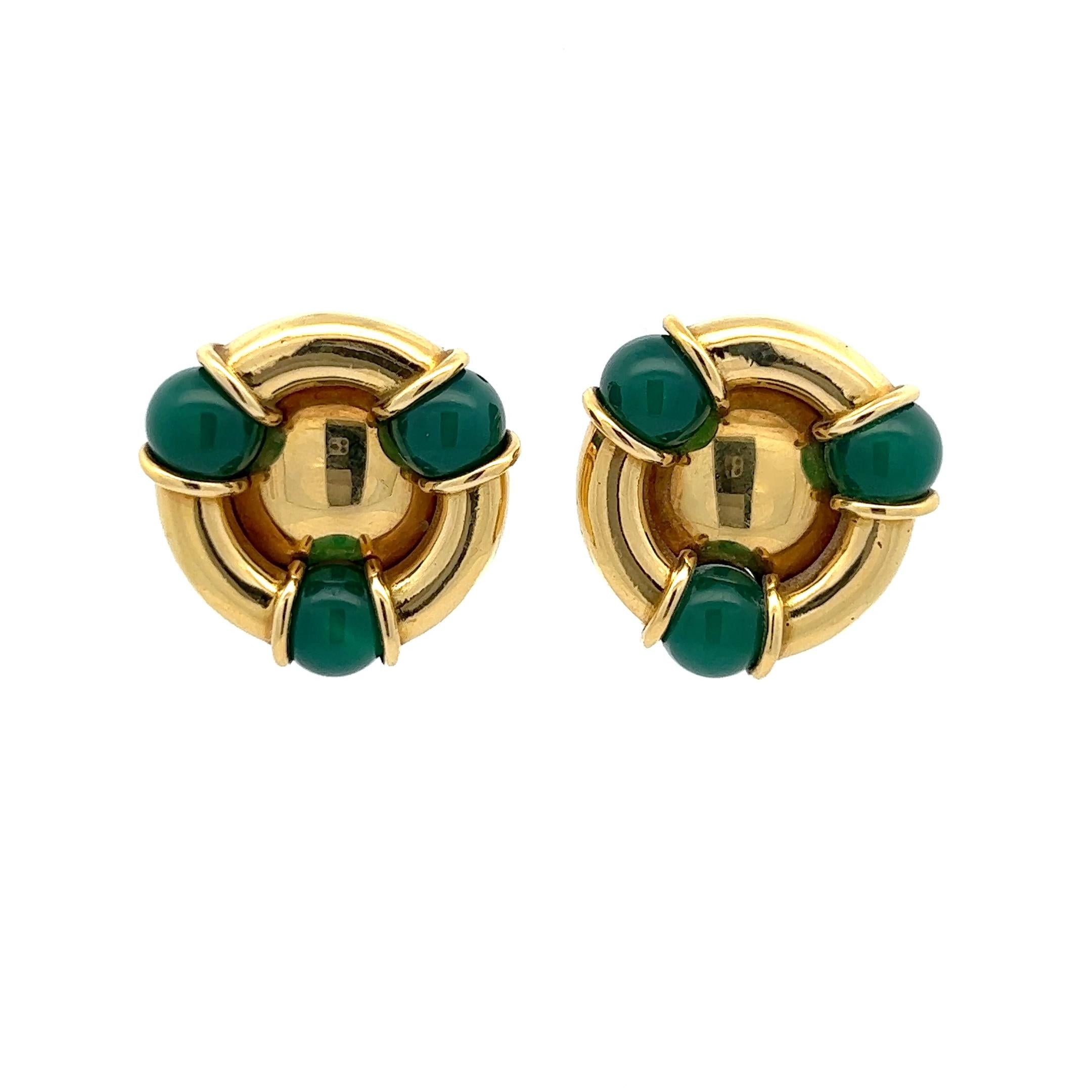 A pair of 18k yellow gold and chrysoprase ear clips by Kiki McDonough.

Origin: London, UK.
Age: 1989.
Measurements: circa 2.5 by 2.5 cm.
Weight: circa 37.7 grams together.
Hallmarks: Marked with the UK hallmarks for 18k gold and for London 1989.