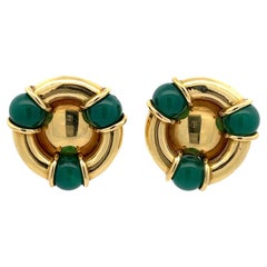 A pair of 18k yellow gold and chrysoprase ear clips by Kiki McDonough.