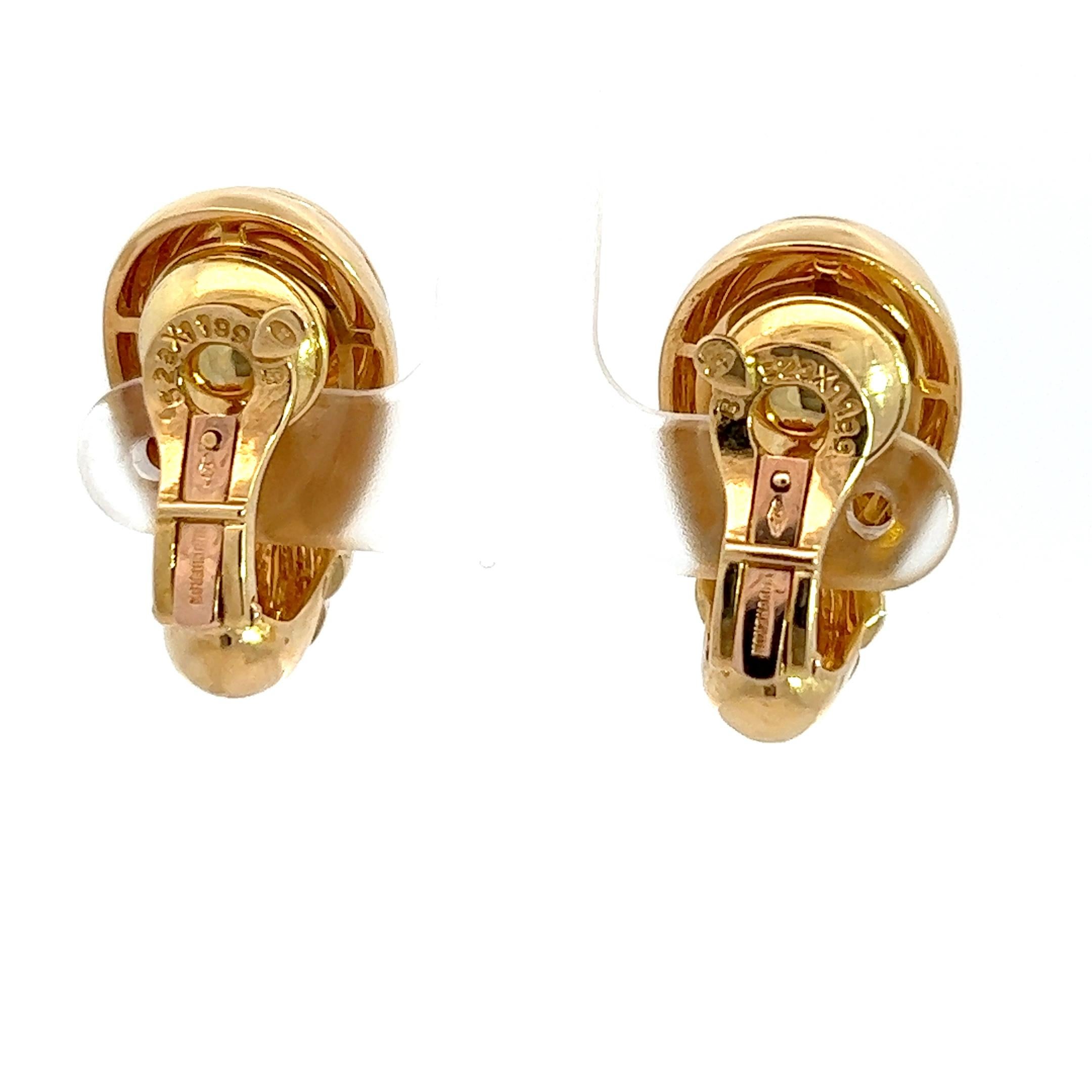 A pair of 18k yellow gold and Citrine ear clips by Boucheron.
The ear clips are circa 2 cm long.
The ear clips are marked with the French and Italian hallmarks for 18k gold.
The ear clips are marked with the French makers mark for Boucheron.
Signed: