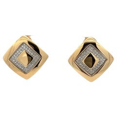 Vintage A pair of 18k yellow gold and diamond earrings by Versace.