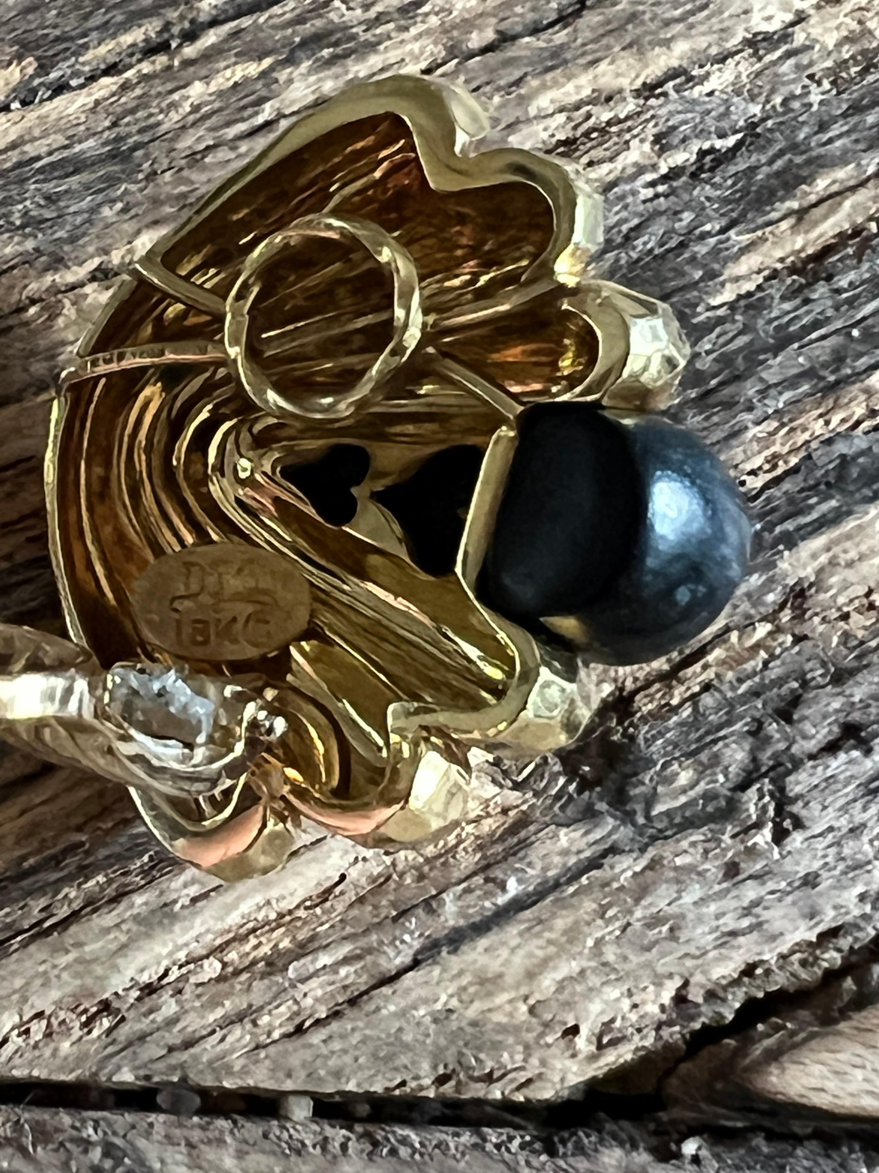 A pair of 18k yellow gold and Ebony 