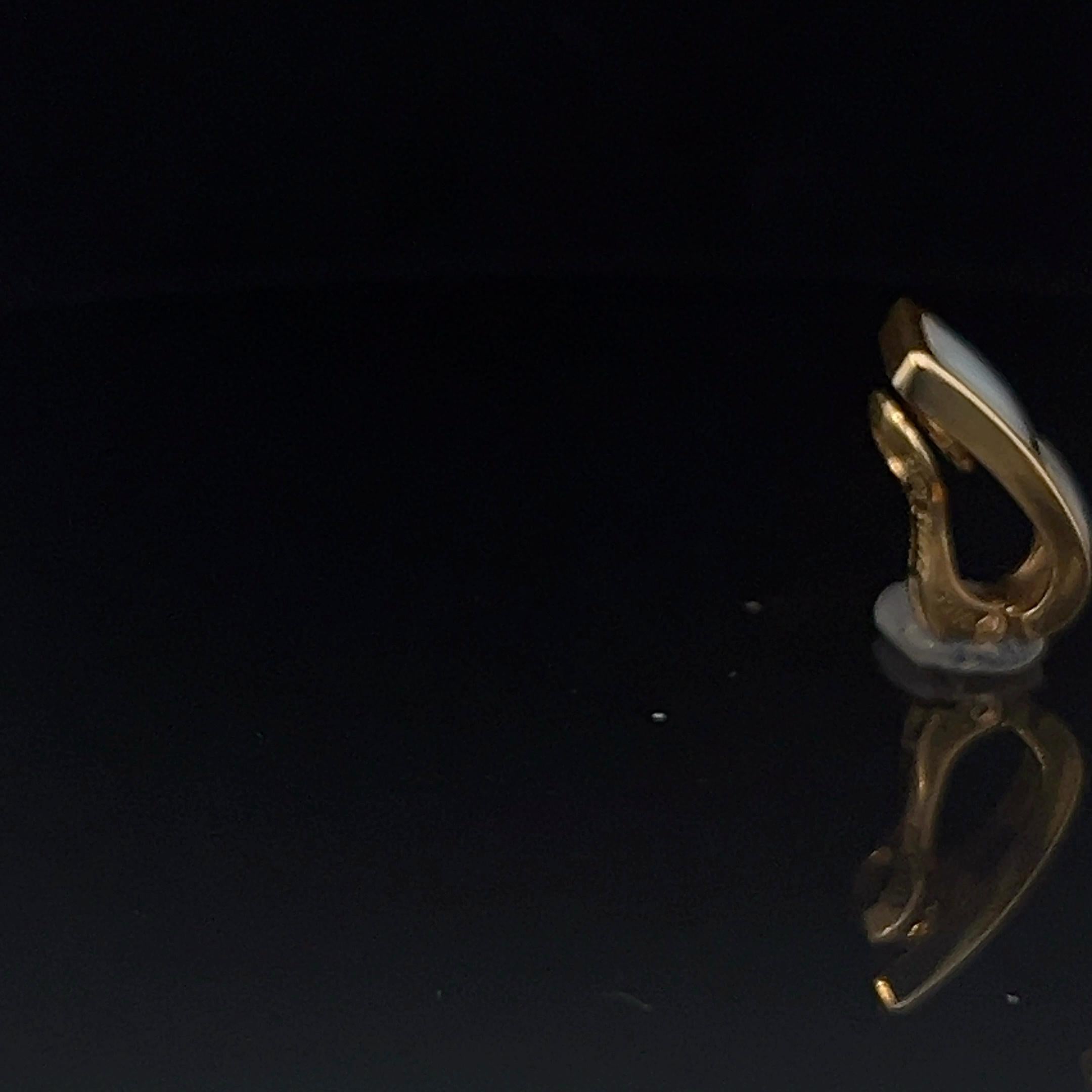 A pair of 18k yellow gold and Mother-of-Pearl ear clips by Mauboussin 6