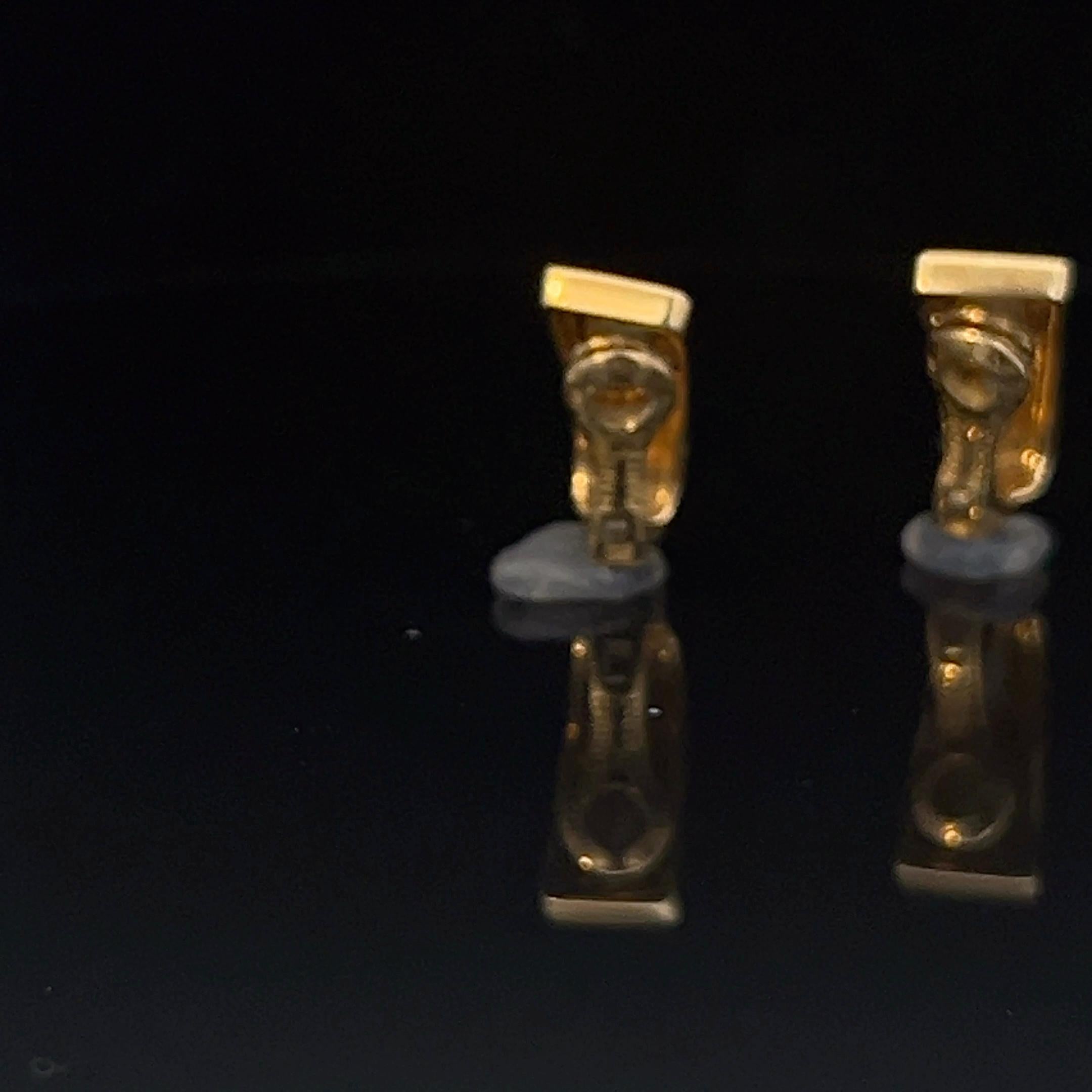 A pair of 18k yellow gold and Mother-of-Pearl ear clips by Mauboussin 7