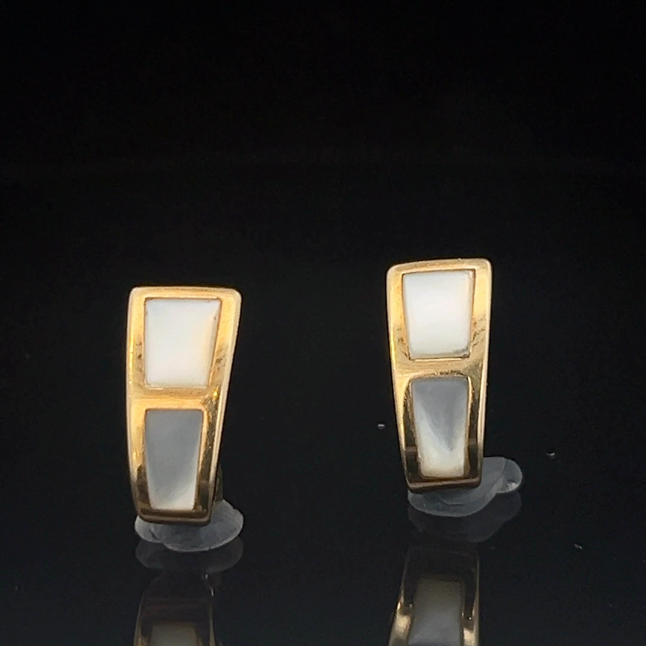 A pair of 18k yellow gold and Mother-of-Pearl ear clips by Mauboussin 5