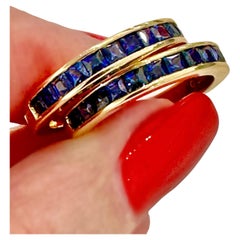 A Pair of 18K Yellow Gold Bands with Square Cut Sapphires Across The Top