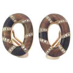A pair of 18k yellow gold, diamond and wooden ear clips by Illario.