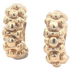 A pair of 18k yellow gold ear clips by Bulgari.