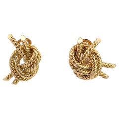 A pair of 18k yellow gold knot ear clips by Georges L'enfant for Hermès