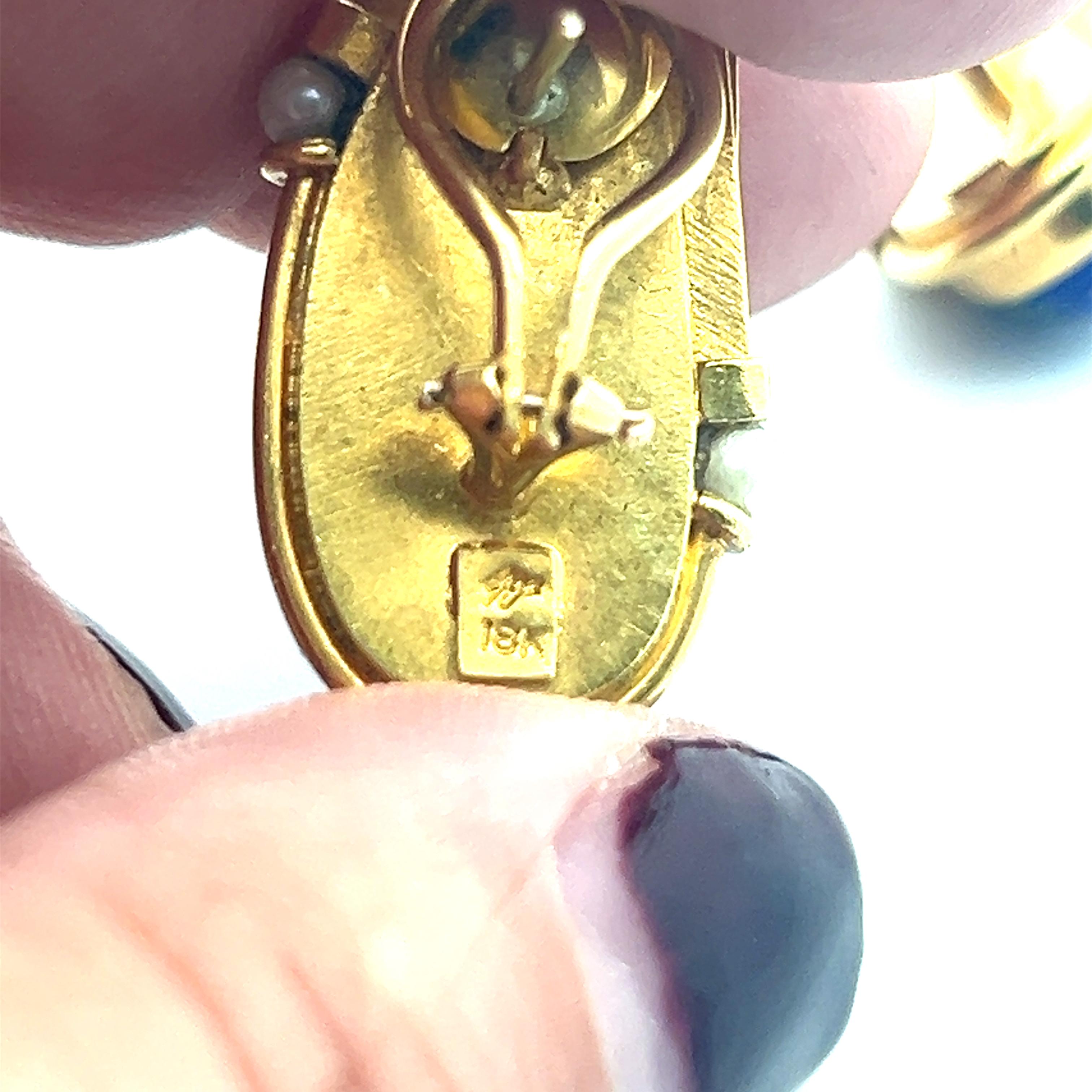 A pair of 18k yellow gold, lapis lazuli and pearl earrings by Erté. 6