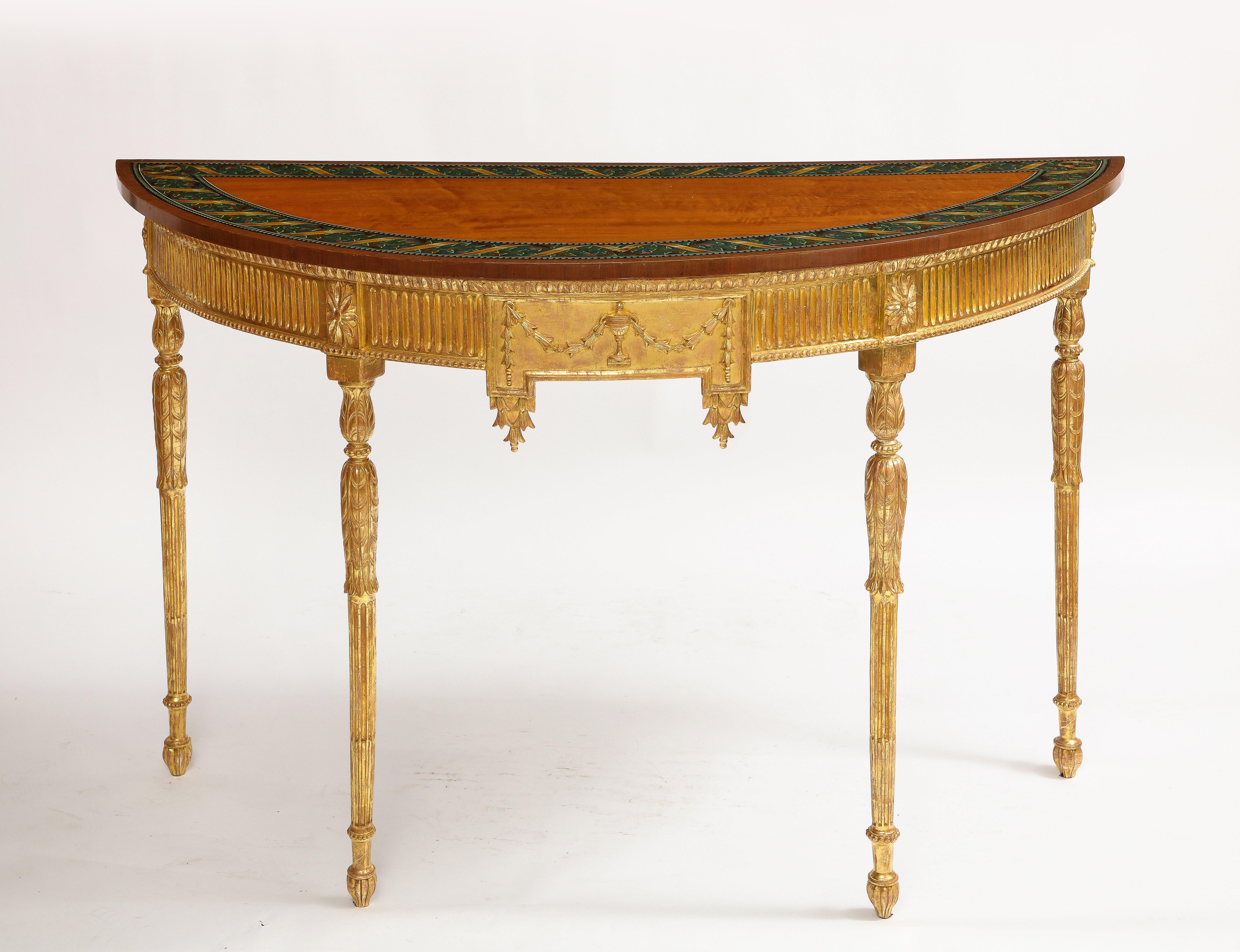 A Fabulous Pair of 18th Century George III Hand-Carved Gilt-Wood Demi-lune Console Tables w/ Painted Floral Still Life Tops. Each top elaborately hand-painted with Floral Still Life designs, the legs headed with rosettes and carved and fluted,