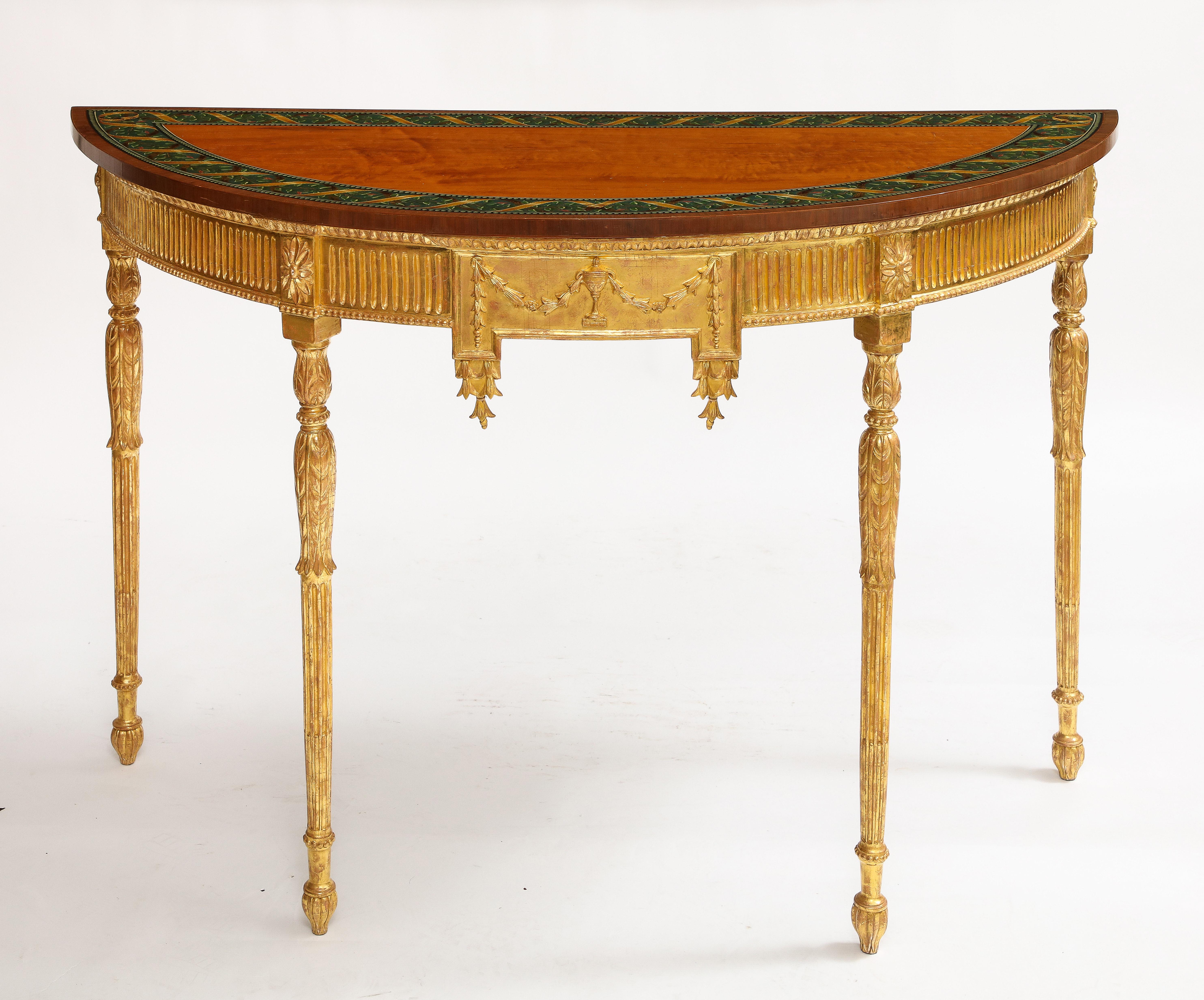 Ein Paar Demi-lune-Konsolen aus vergoldetem Holz aus dem 18. Jahrhundert mit bemalten Tischplatten (George III.)