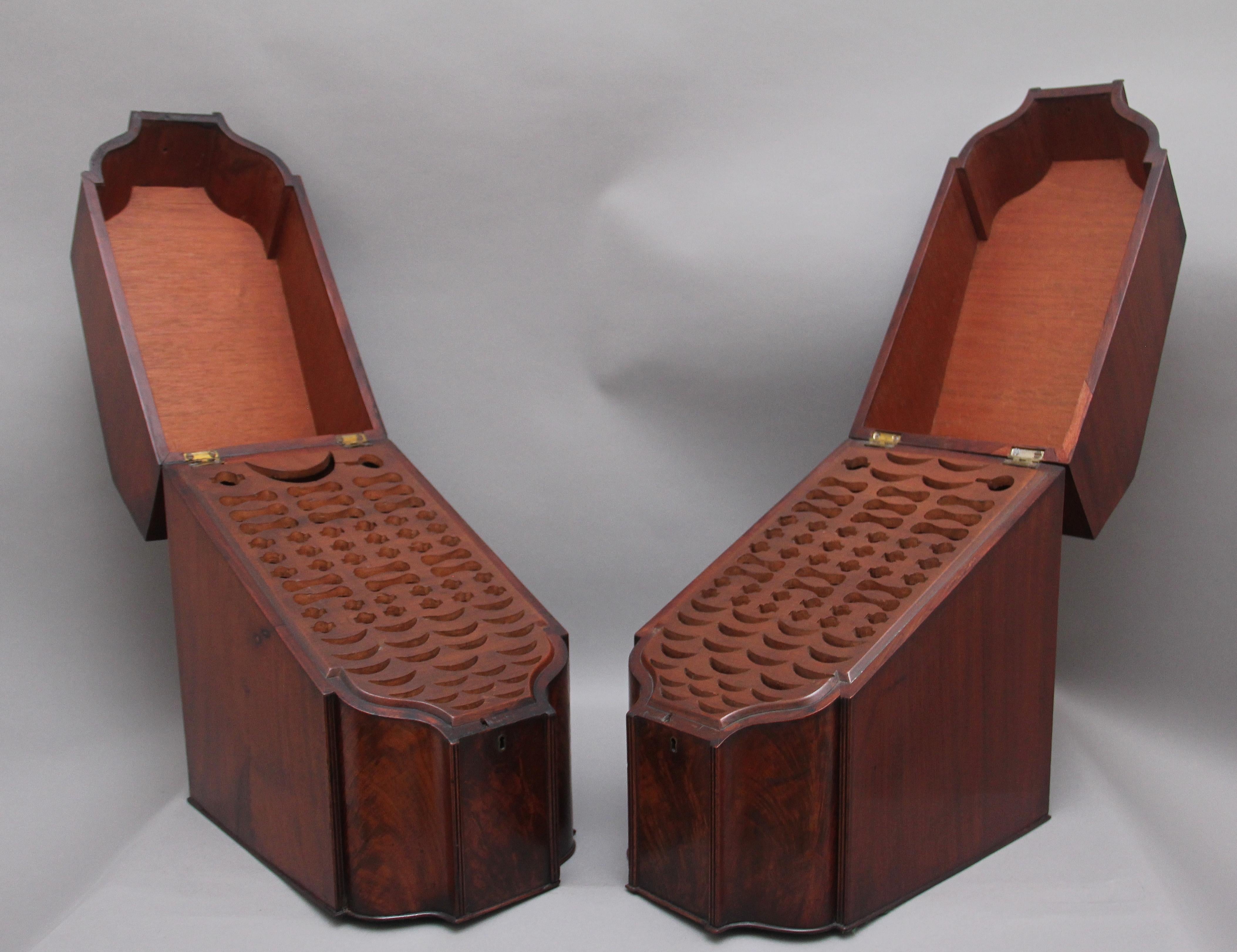 A pair of superb quality 18th Century mahogany knife boxes from the Georgian period, having a wonderful figuration throughout, decorative shaped front, with the sloping hinged lid opening to reveal a fitted interior, both boxes are baized