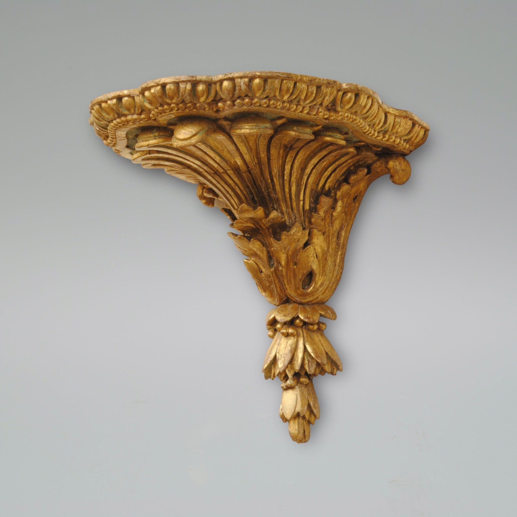 A well carved pair of giltwood wall brackets with egg and dart around the tops and acanthus and hair bells below. 
Circa 1785