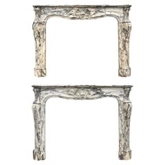 A Pair Of 18th Century French Louis XV Breche Violette Marble Fireplace Mantels