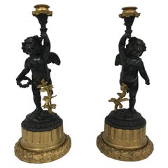 Pair of 18th. Century French Panted Bronze and Ormolu Candlesticks